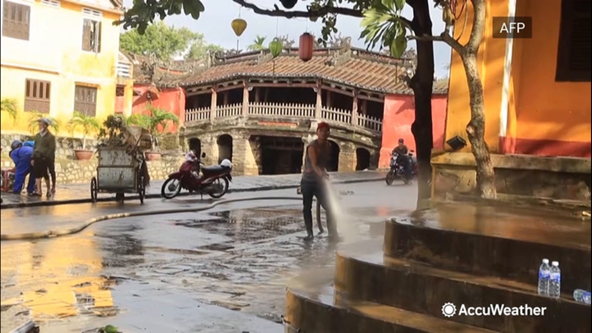 Residents removed mud and debris from the streets and streams of Hoi An, Vietnam, on Oct. 30 after Typhoon Molave  caused flash flooding in the city.