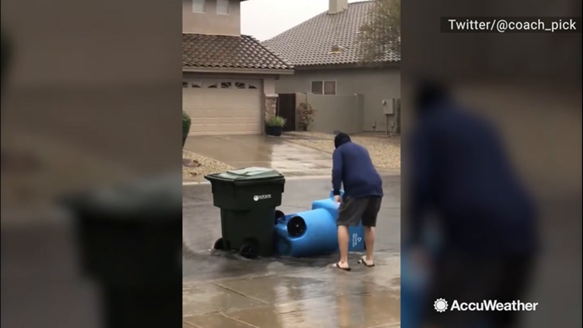 On Nov. 20, a powerful rainstorm swept through Phoenix, Arizona, completely inundating streets. The floodwaters swept away one man's trashcans.