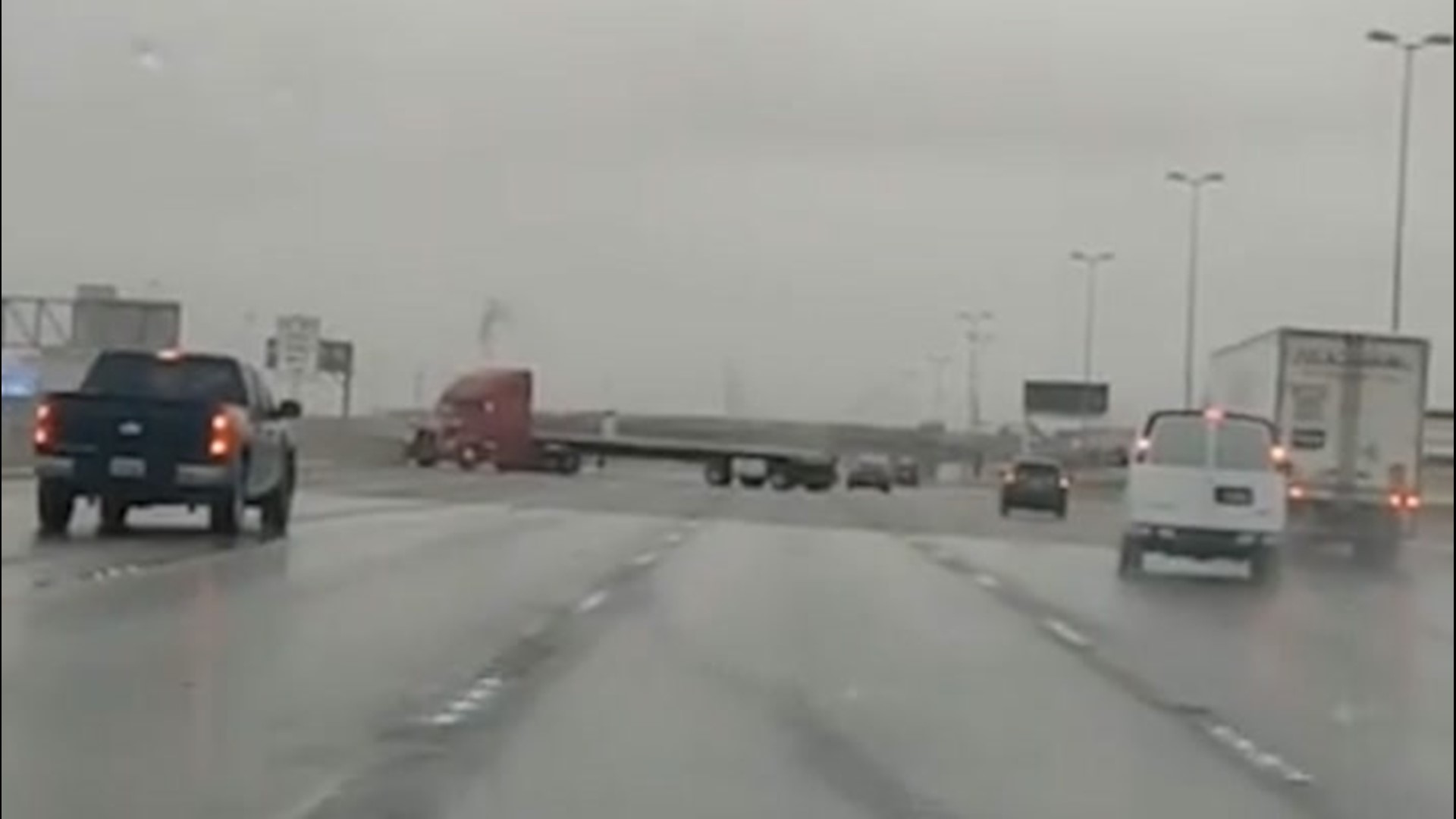 Truck loses control on slippery highway