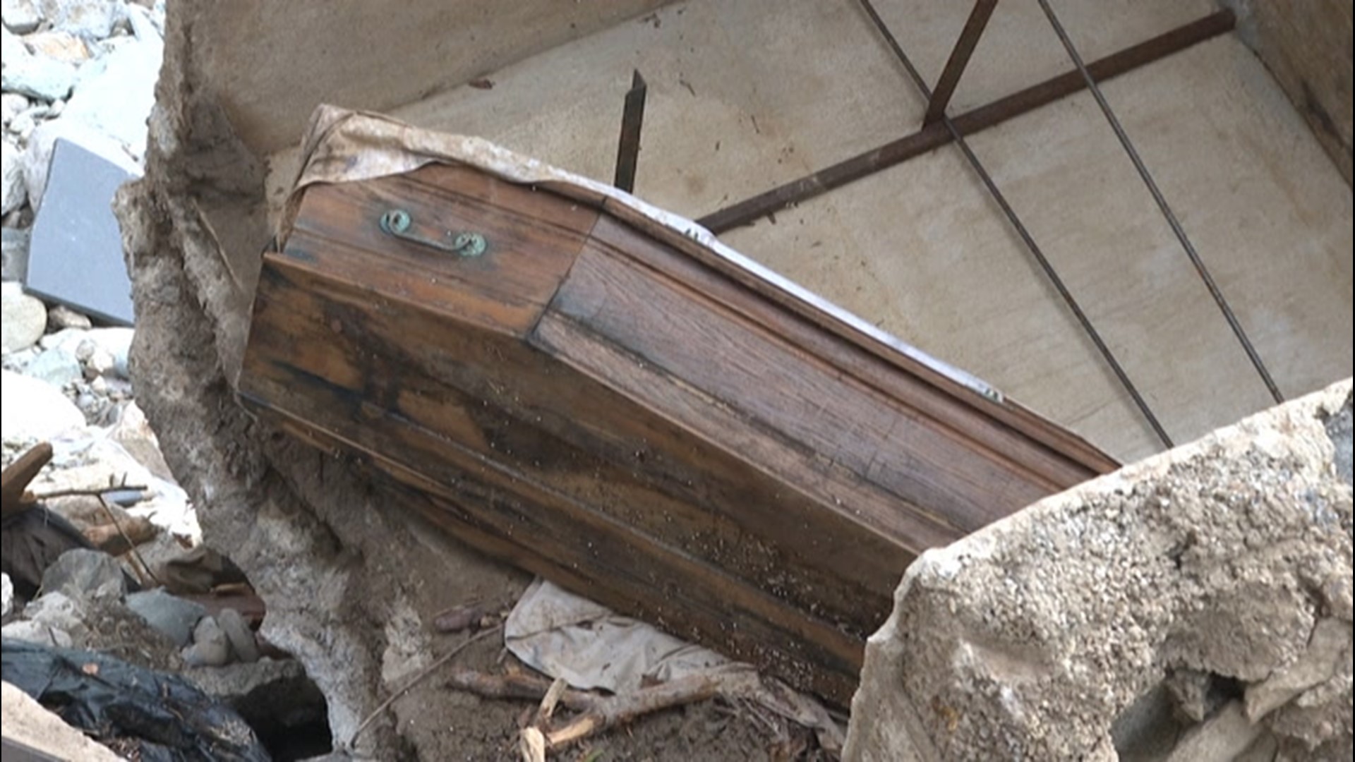 Caskets were seen out of the ground at a cemetery in Saint-Dalmas de Tende, France, on Oct. 6, after flooding washed out 75% of the cemetery on Oct. 2.