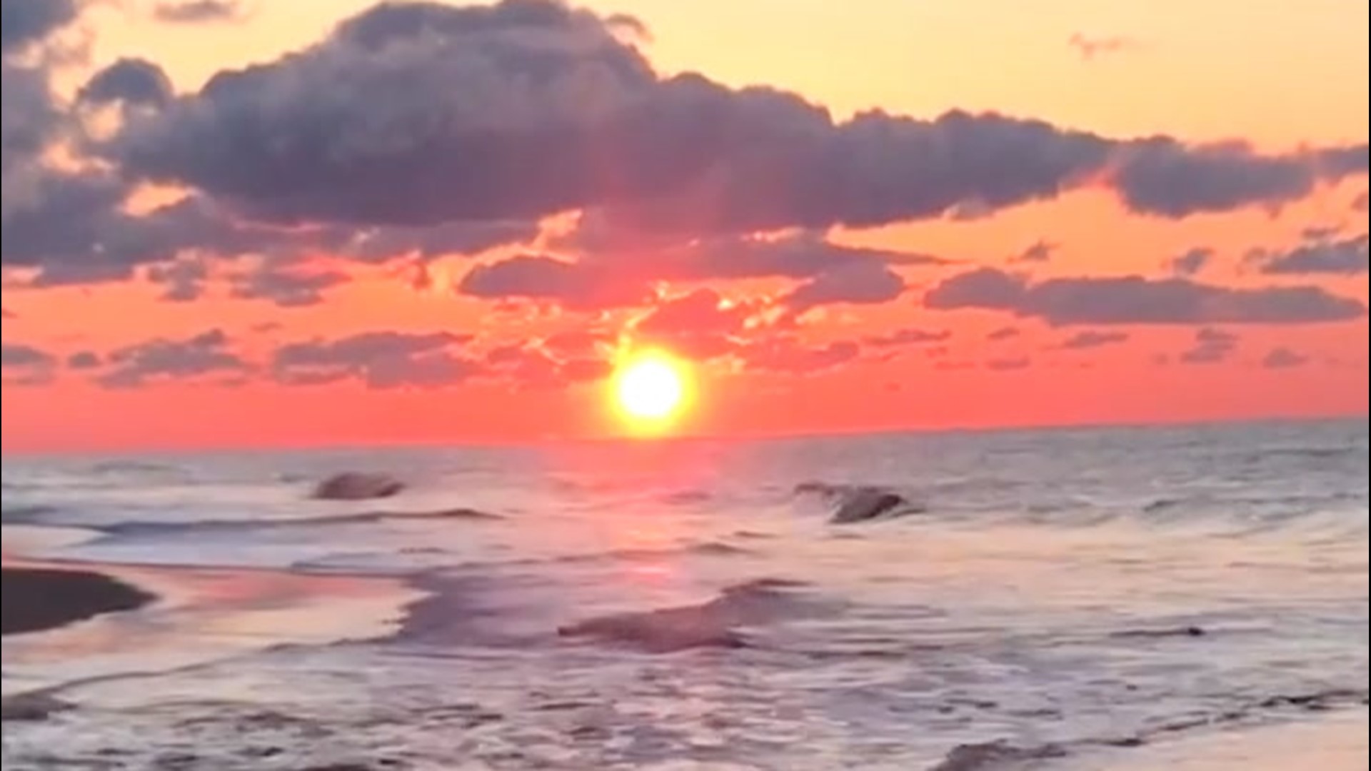 Watch this beautiful sunrise with purple clouds over crashing waves in Bridgehampton, New York, on April 17.