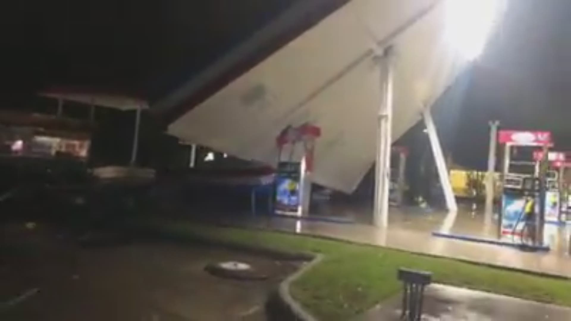 Video taken by Mark Cogdell shows a gas station on Market St. in Wilmington, North Carolina collapsing in Hurricane Florence's winds.