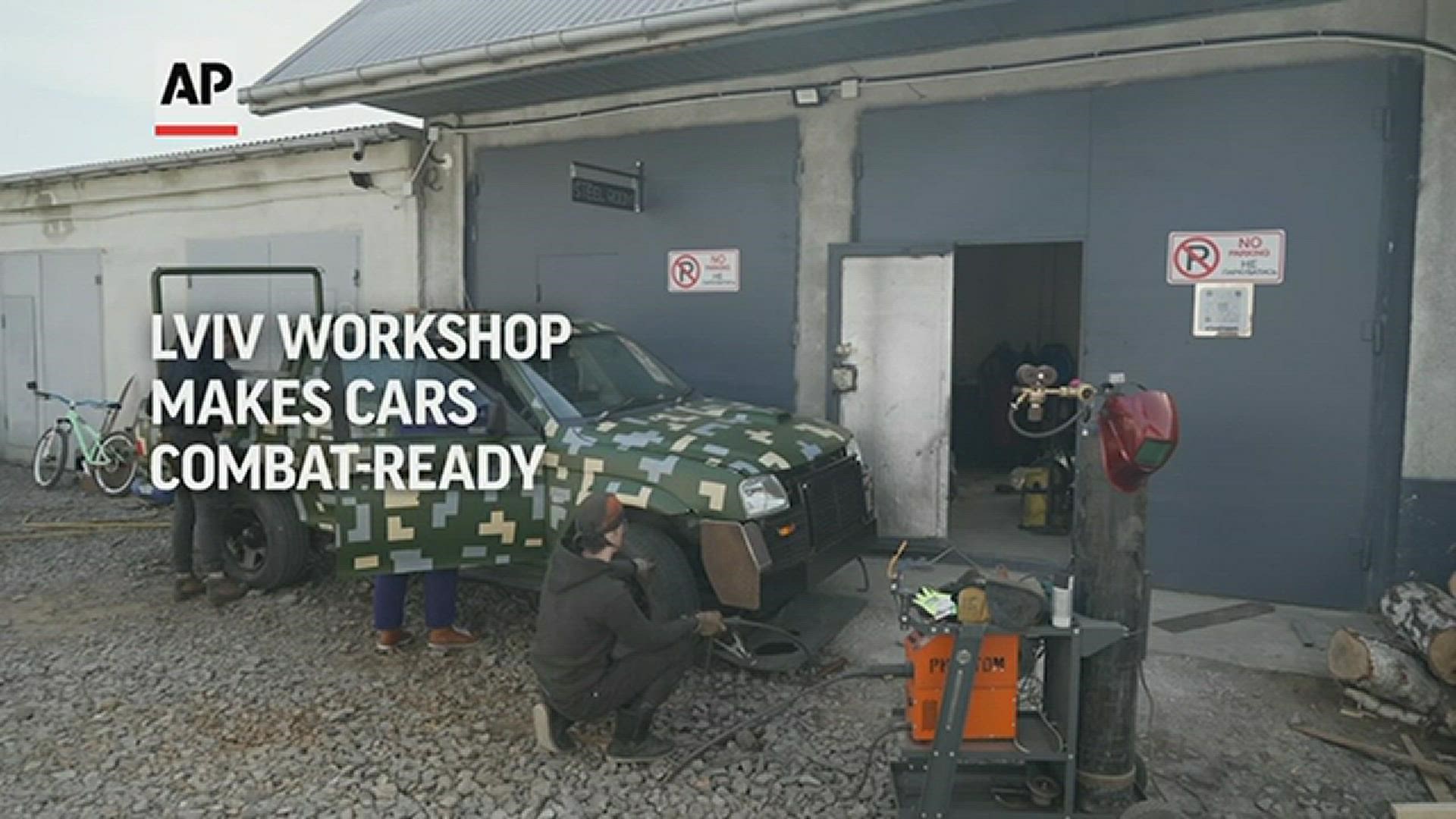 In a welding shop in Ukraine's western city of Lviv, workers were adding steel plates to a donated pickup truck so a volunteer could drive it to the front.