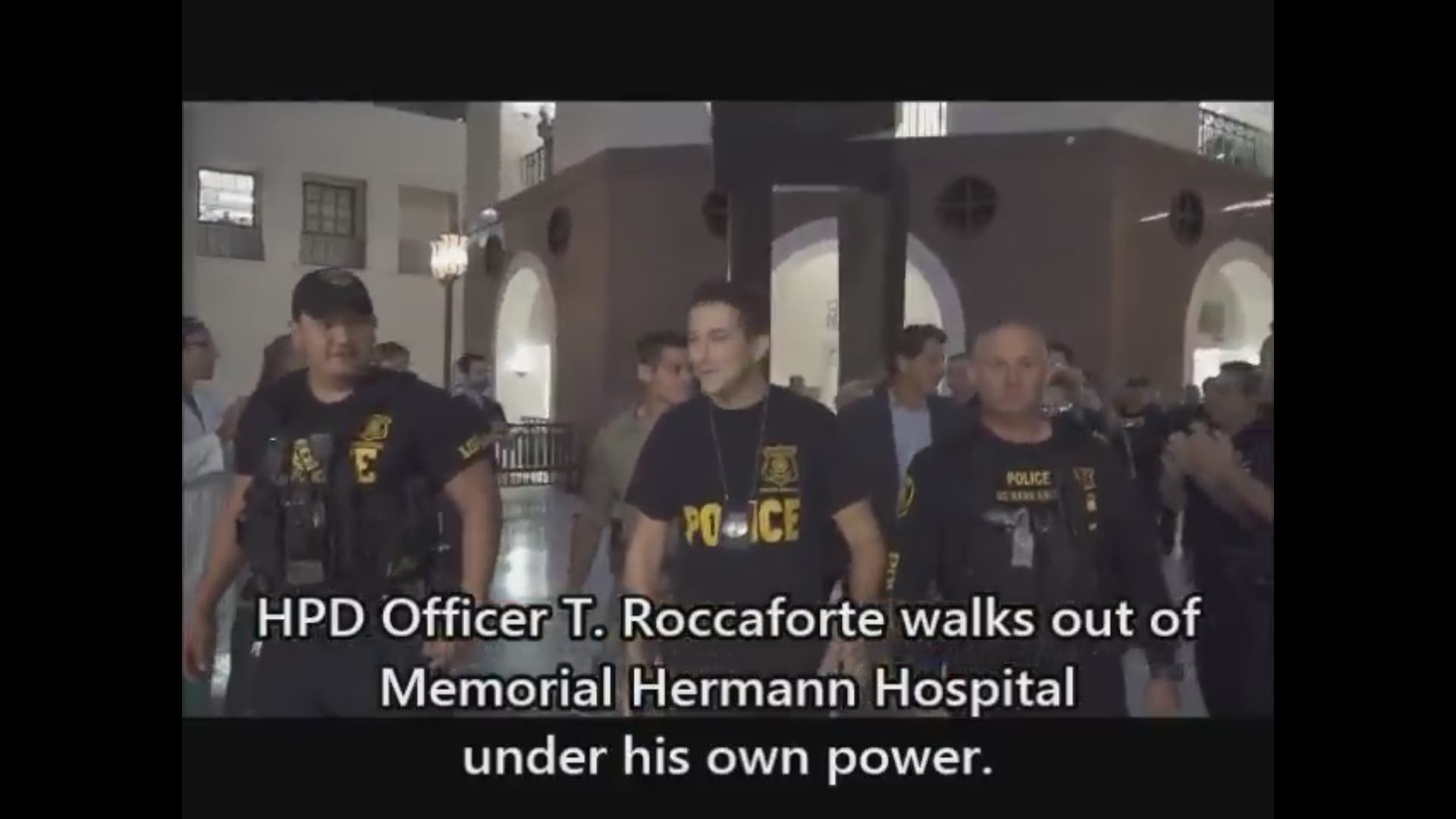 HPD shared video of Officer T. Roccaforte walking out of Memorial Hermann Hospital with fellow officers on hand