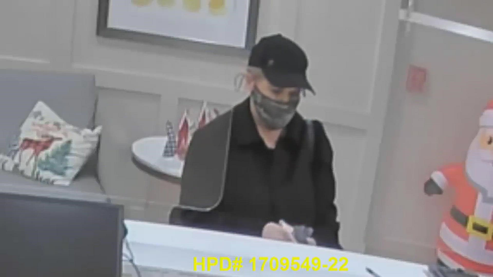 The woman, 40 to 50 years old, wore a mask, high heels and a black ballcap that covered her gray or blonde hair, according to the Houston Police Department.
