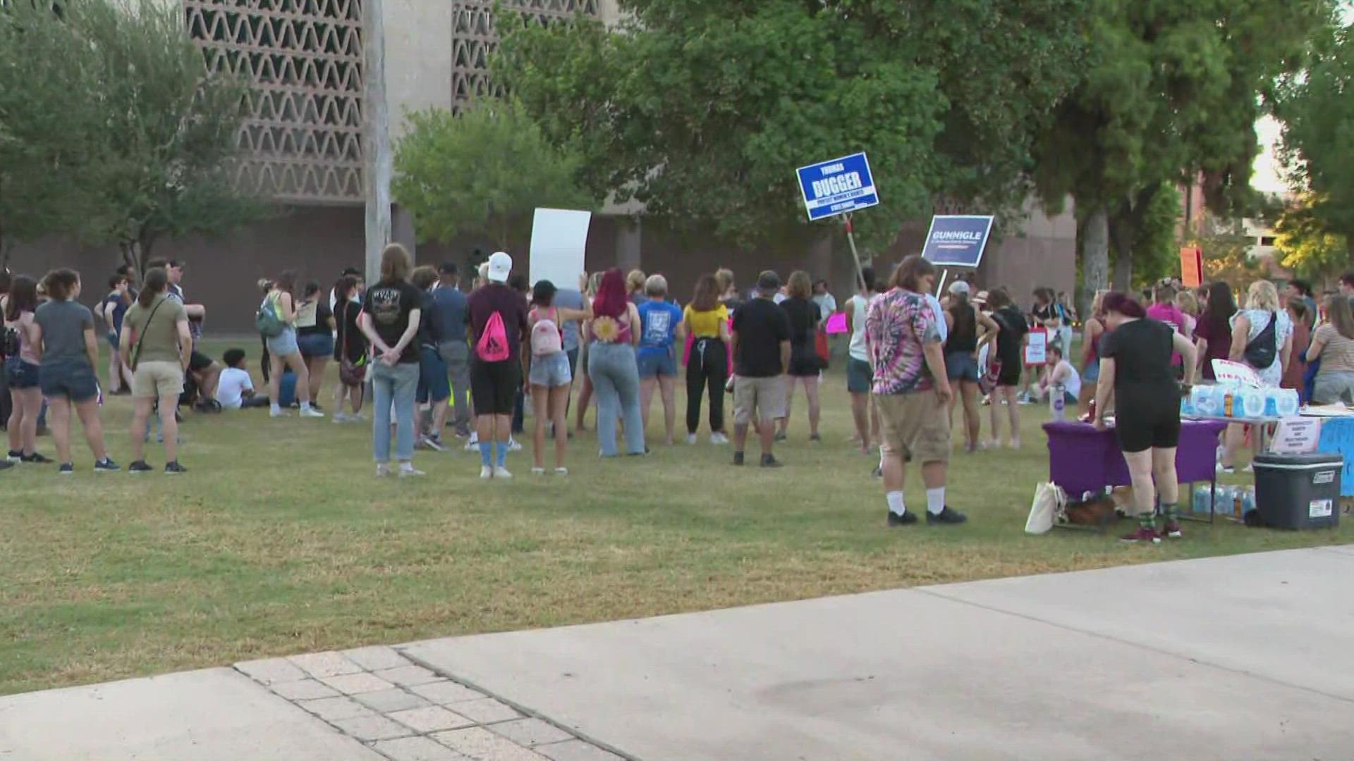 For a second day, people rally at the Arizona State Capitol following a judge's near-total abortion law on Friday.