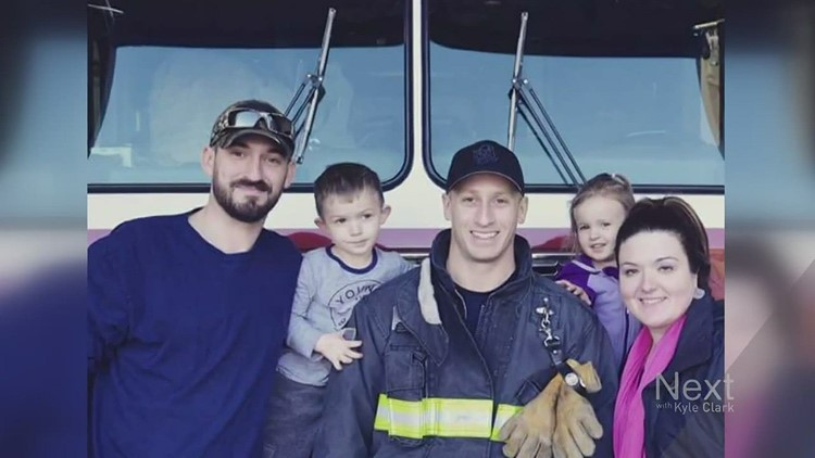 Firefighters helps family after a house fire