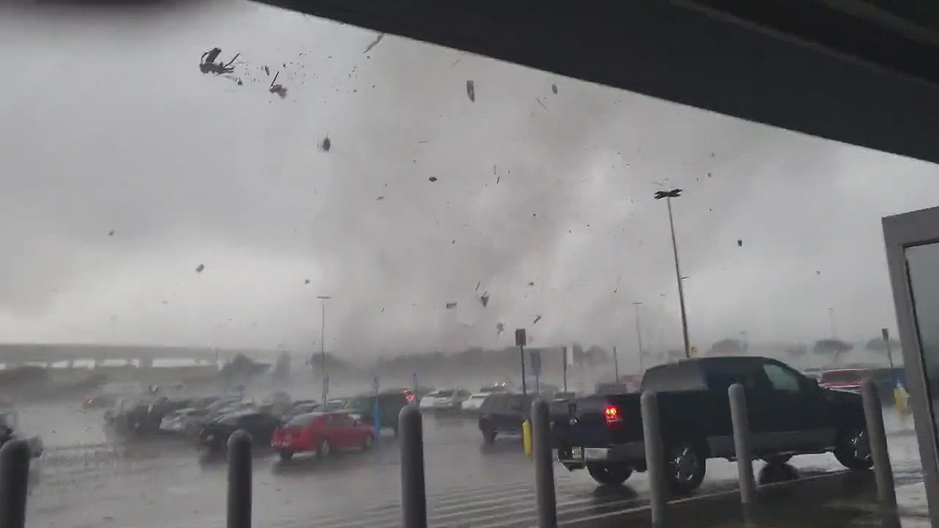 Viewer footage shows chaos outside of a Round Rock Walmart on Monday, March 22, when a tornado touched down nearby. Credit: "Ya Boi James Watson"