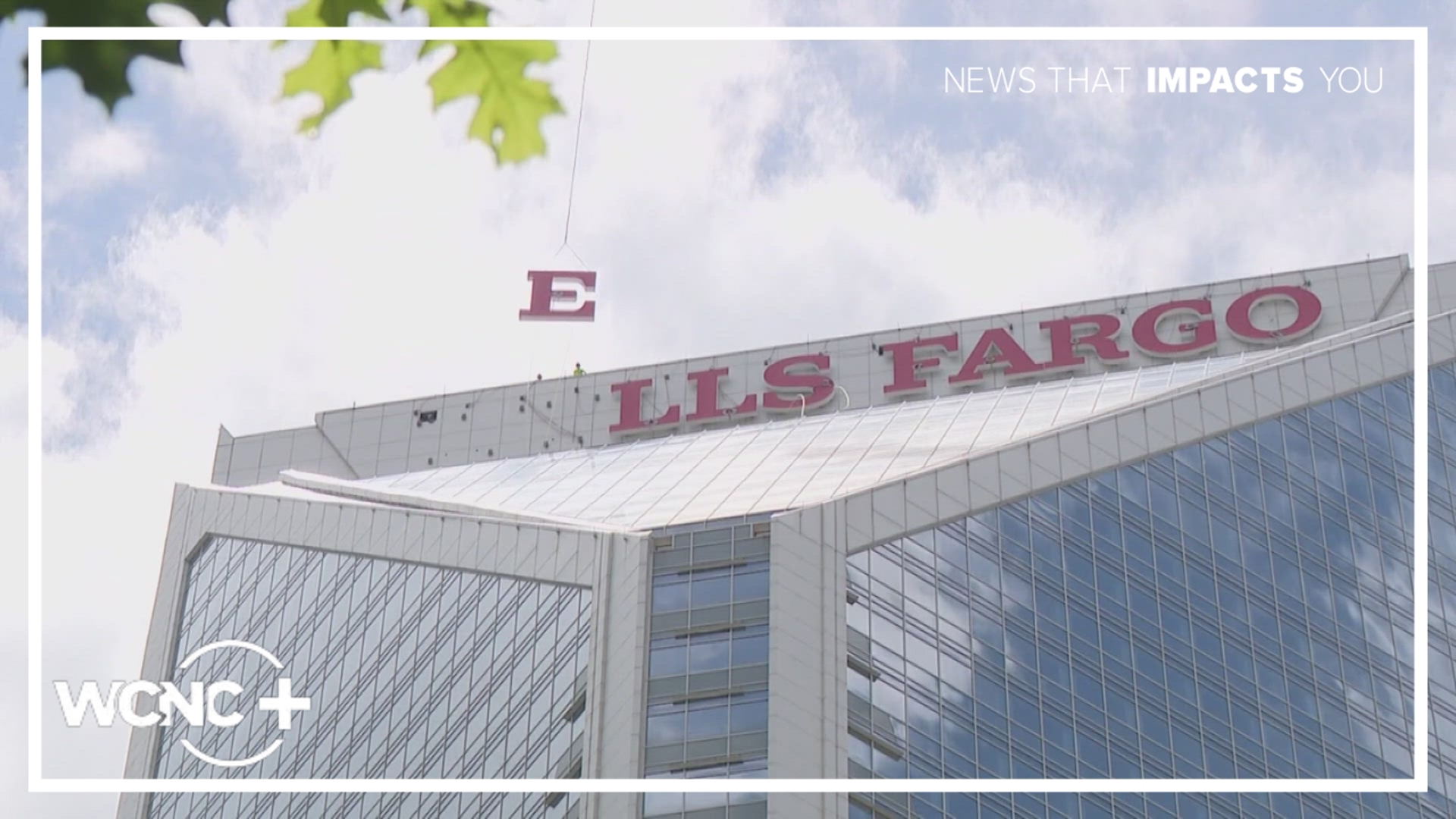 Helicopters were used to lift the large letters to the top of the former Duke Energy building. 