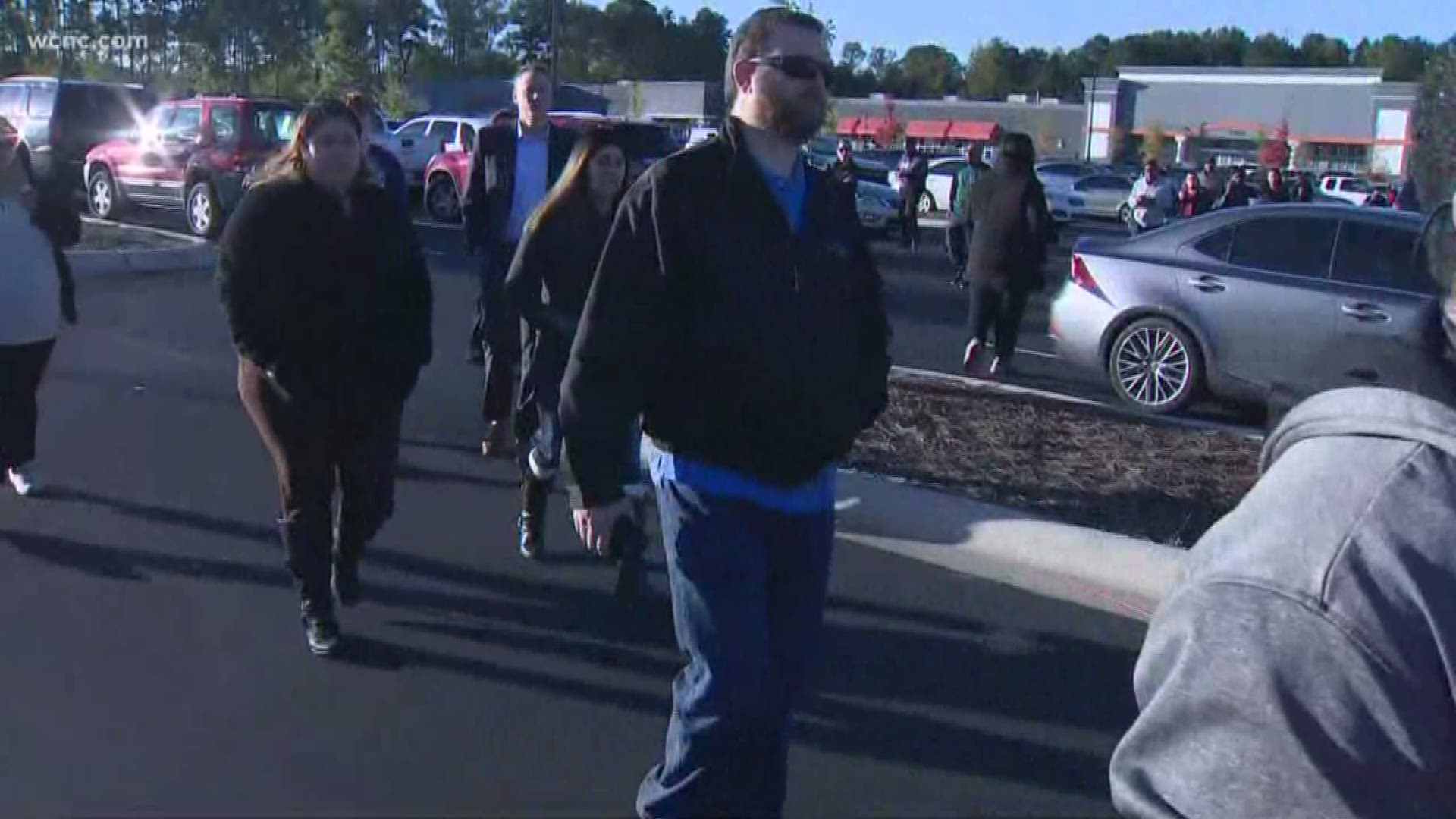 Frustrated parents organized a march to get their children from school after a shooting on the campus of Butler High School in Matthews Monday.