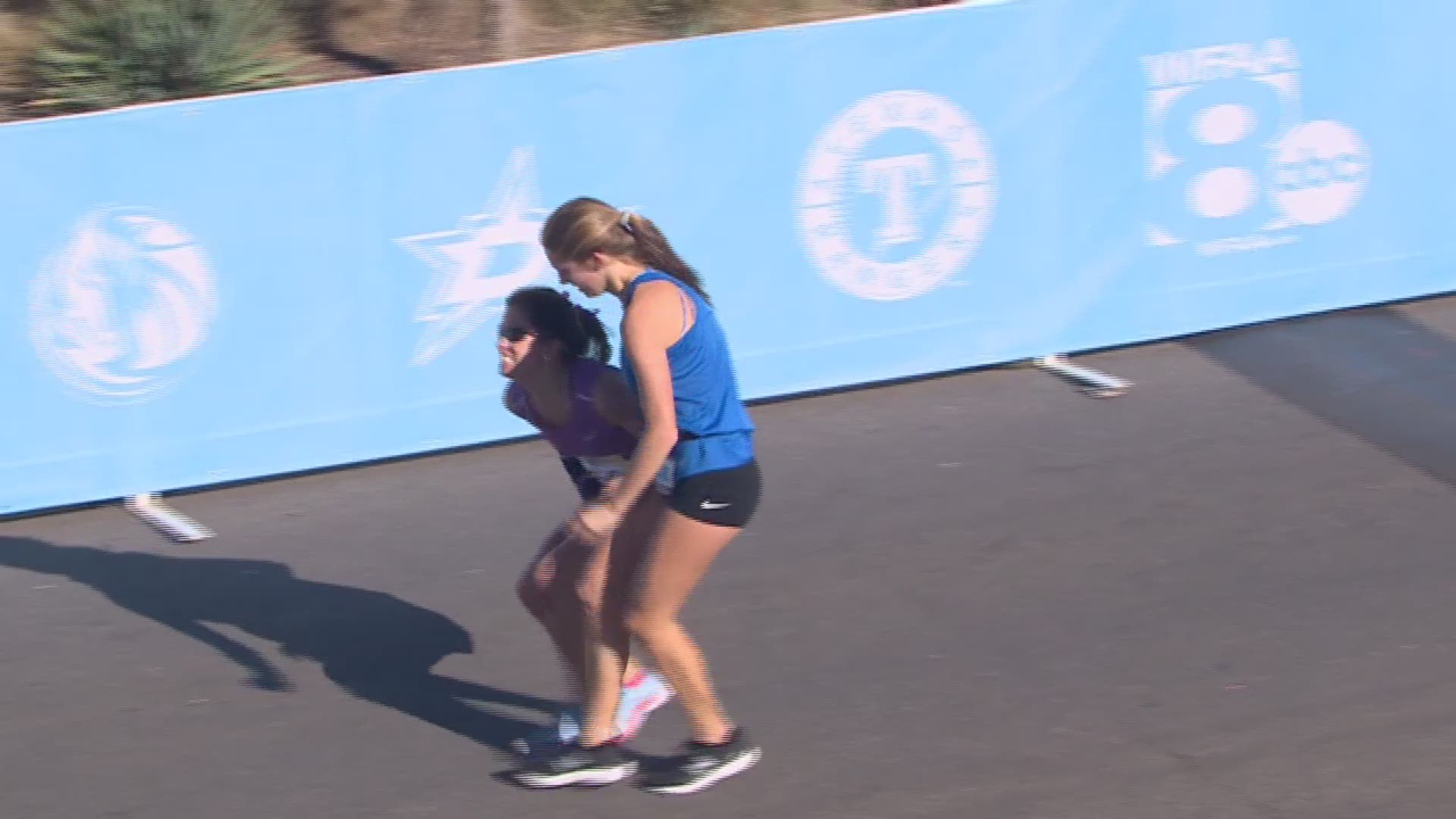 WATCH: Winner in women's finish at the BMW Dallas Marathon falls to the ground
