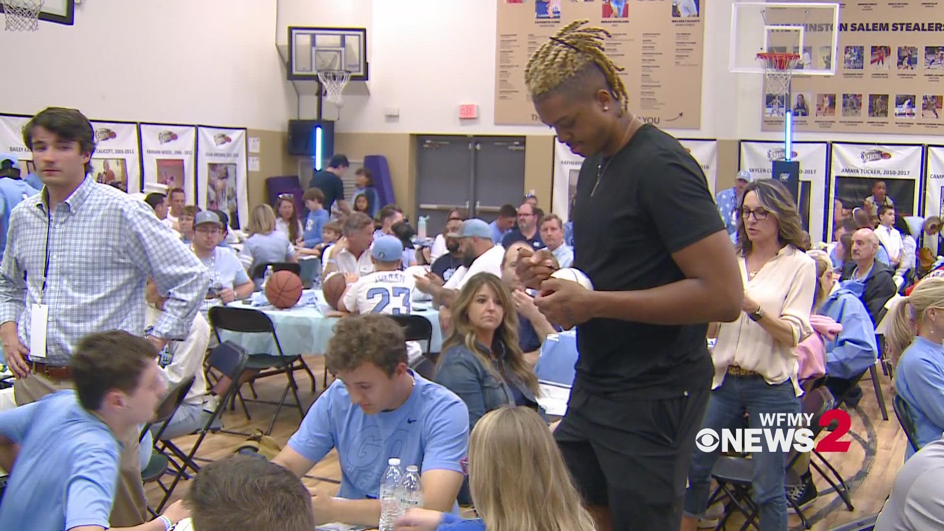 UNC basketball players sign autographs at the Iron Five Tour stop in Kernersville.