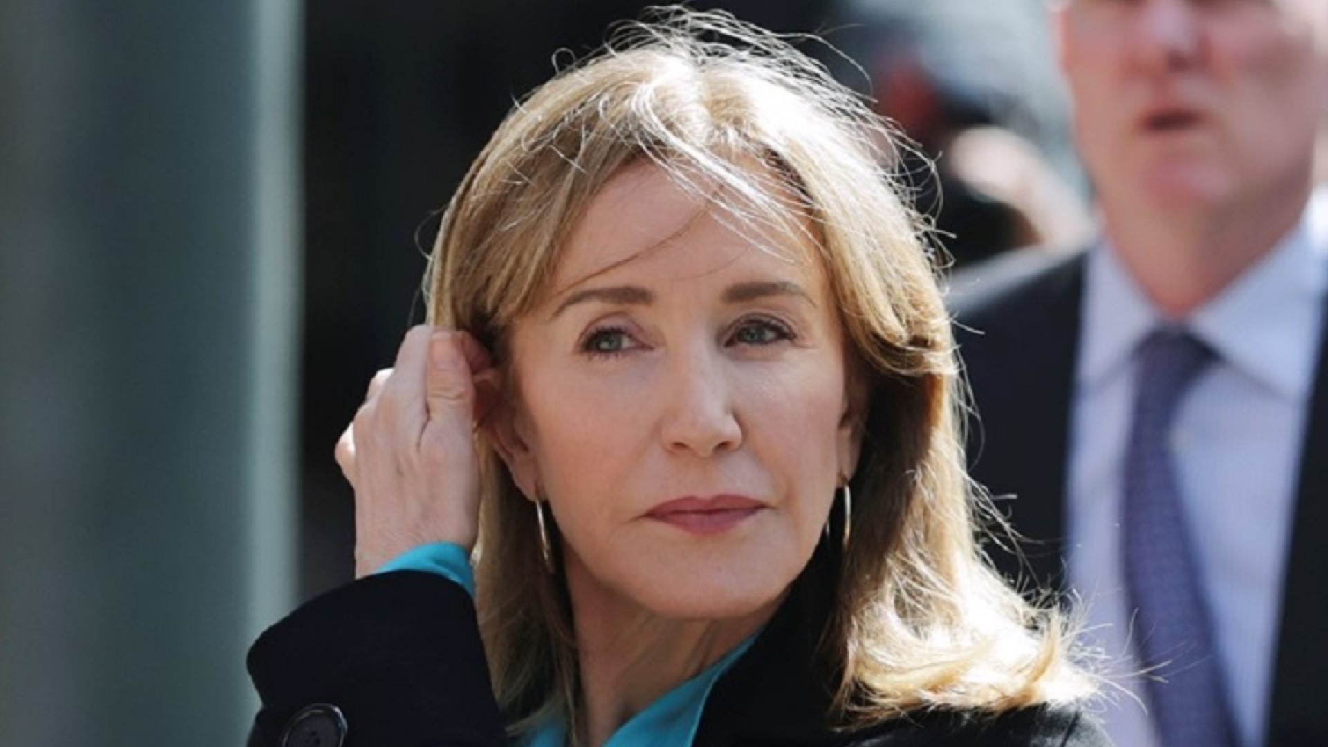 Actress Felicity Huffman has been sentenced to 14 days in prison for her role in the sweeping college admissions scandal. The "Desperate Housewives" star was sentenced in Boston's federal court Friday after pleading guilty in May to a single count of conspiracy and fraud. She was also given a $30,000 fine, 250 hours of community service and a year of supervised release.