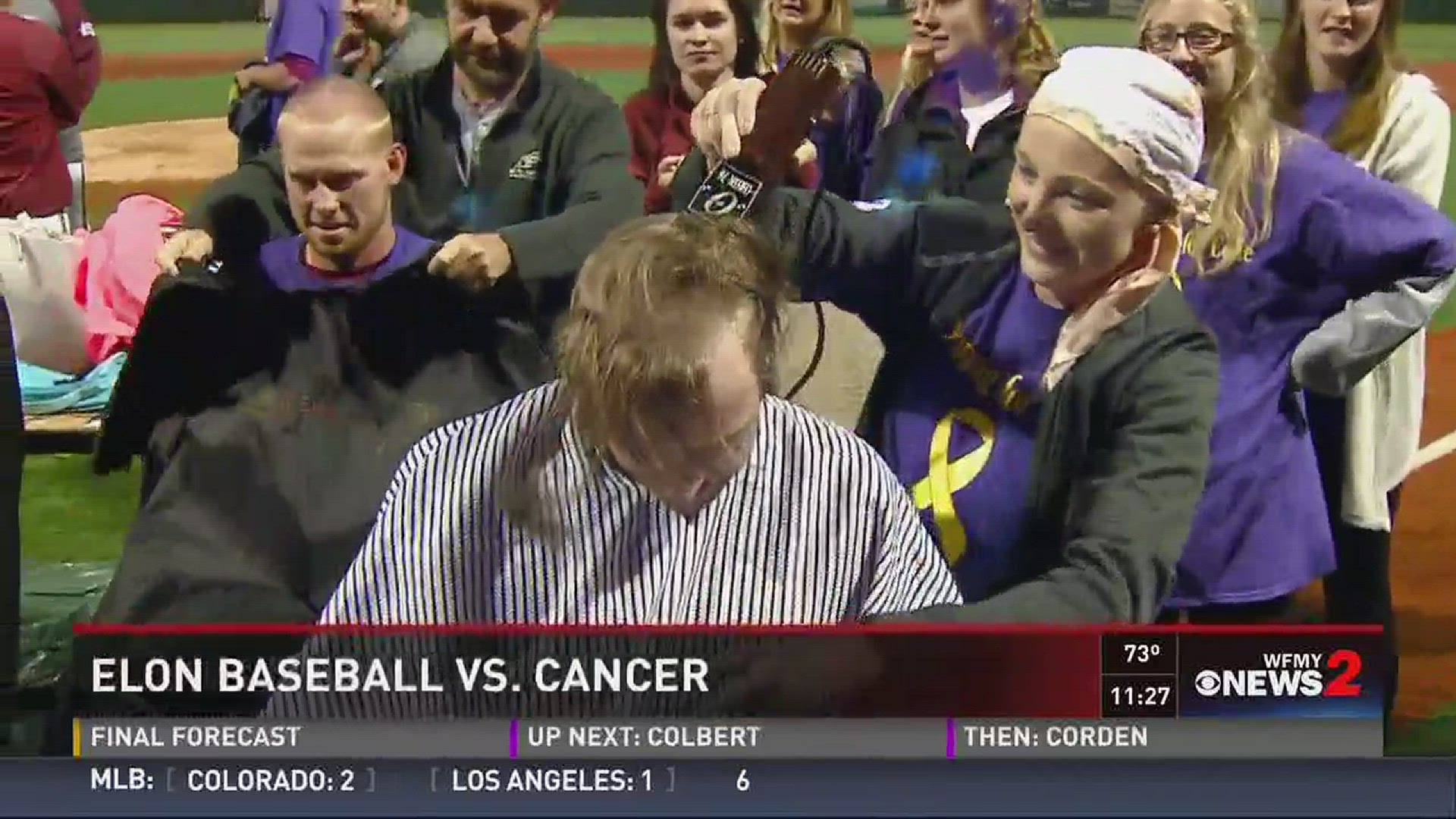 Elon University's baseball team shaves their heads to raise money for student battling cancer.