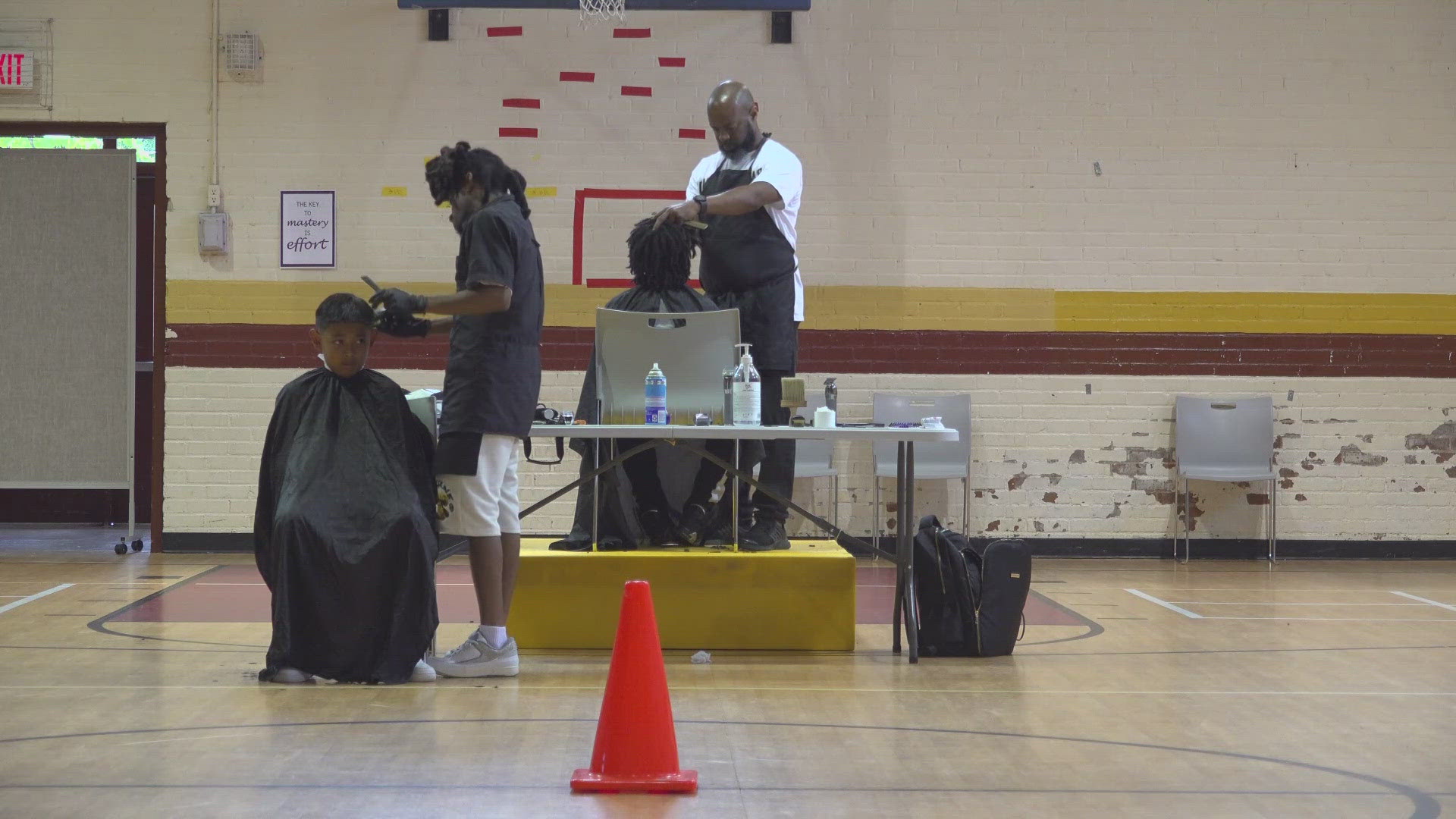 GCS Barbers Building Brotherhood gave rising 6th graders free haircuts ahead of 5th grade promotion.