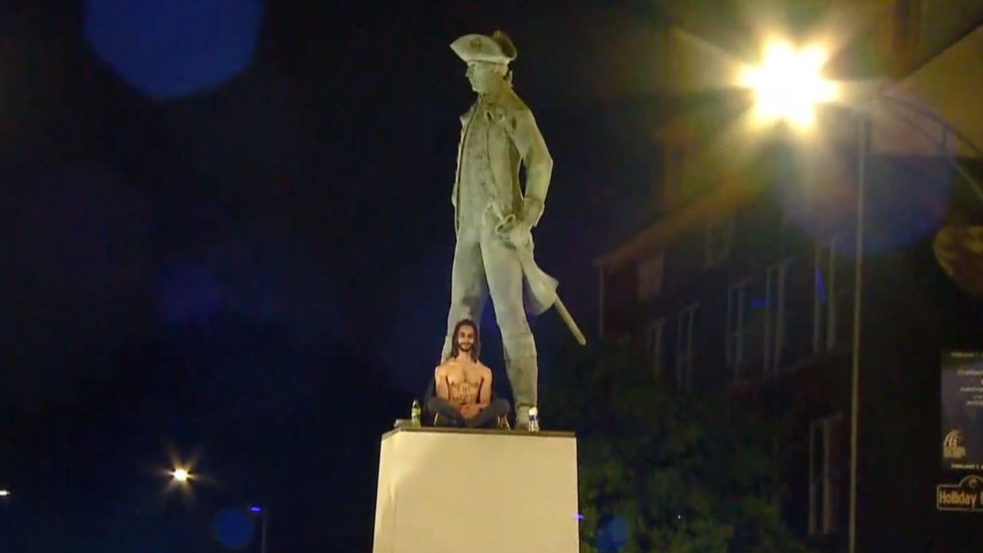 A protester was removed by the fire department after climbing a statue in downtown Greensboro. That's after a protest was dispersed following a citywide curfew.