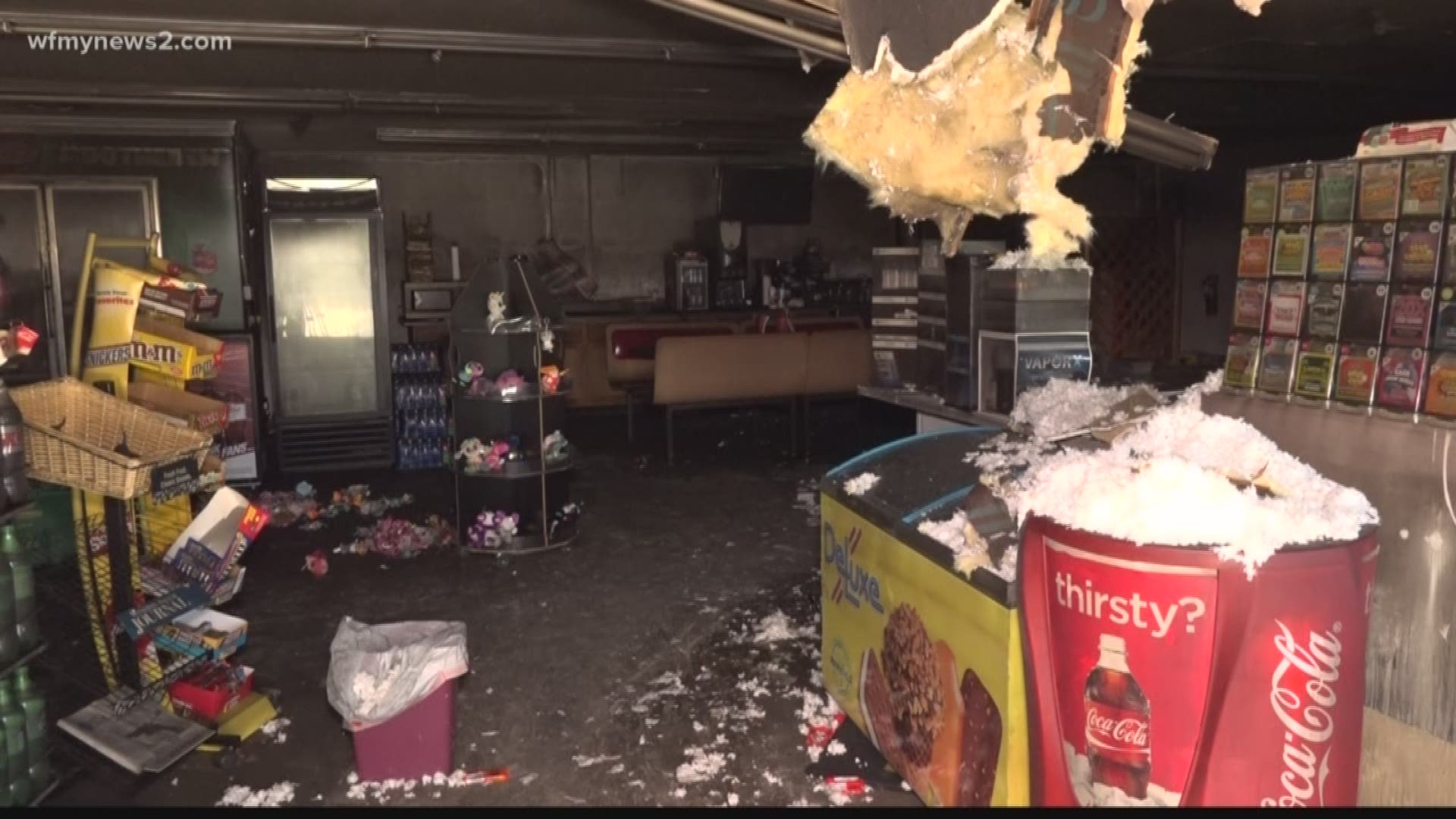 The Stop and Save store on Styers Ferry Road was robbed and set on fire with a store clerk inside.