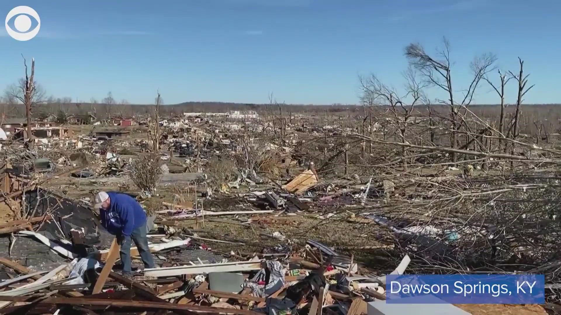 Dawson Springs, Kentucky, was one of the hardest-hit communities when tornadoes tore through the state Friday night. People sifted through debris Sunday.