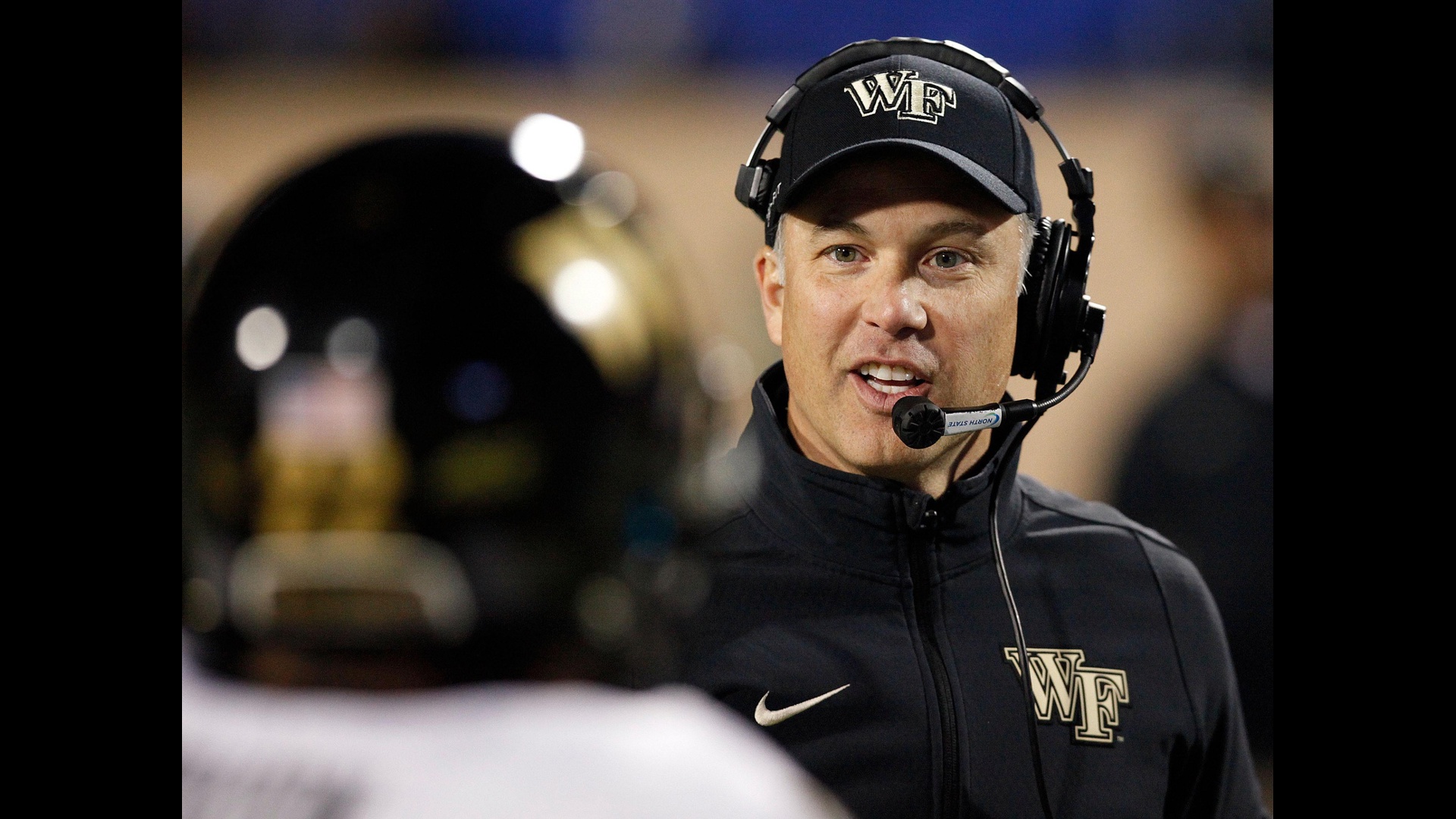 We explain why Dave Clawson says he's stepping down from head coaching role.