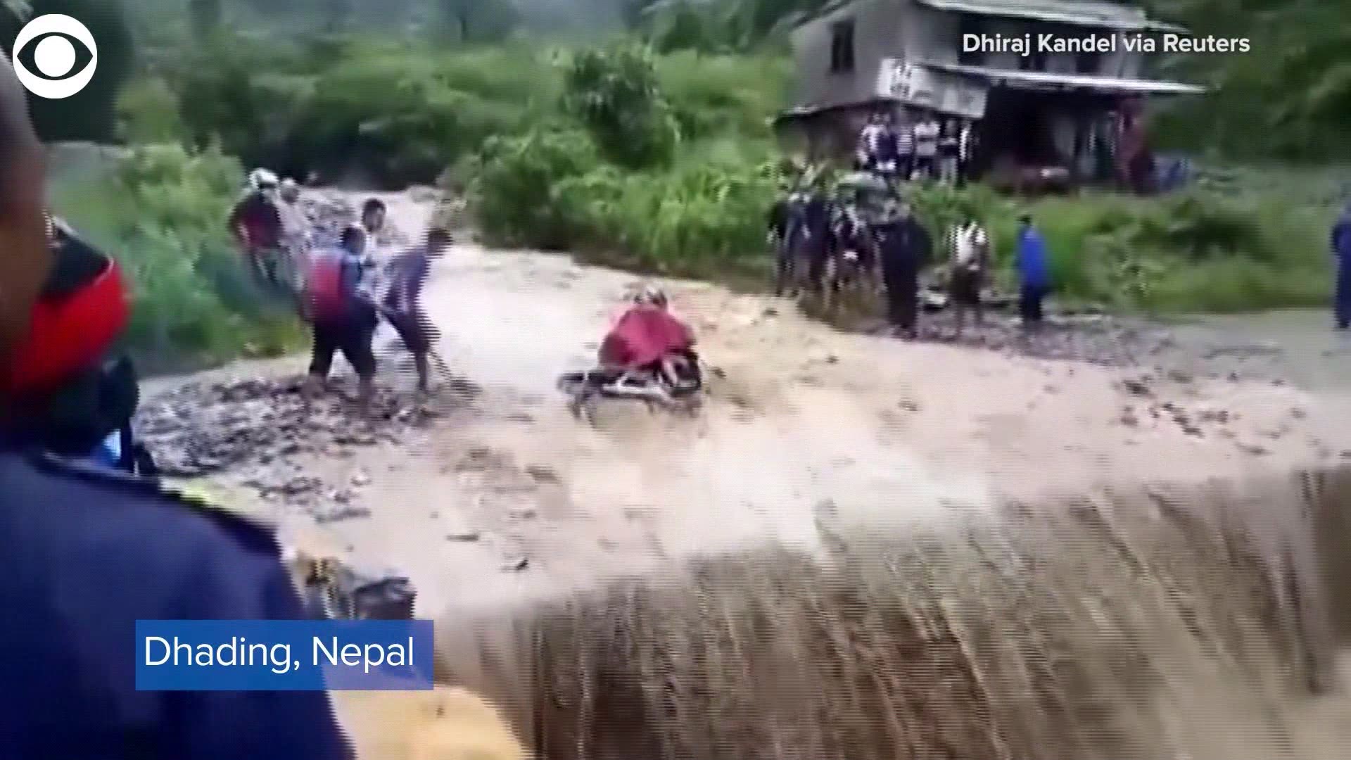 Watch the moment floodwaters swept a motorcyclist off the road in Nepal. Witnesses were able to rescue the man and even the motorcycle.