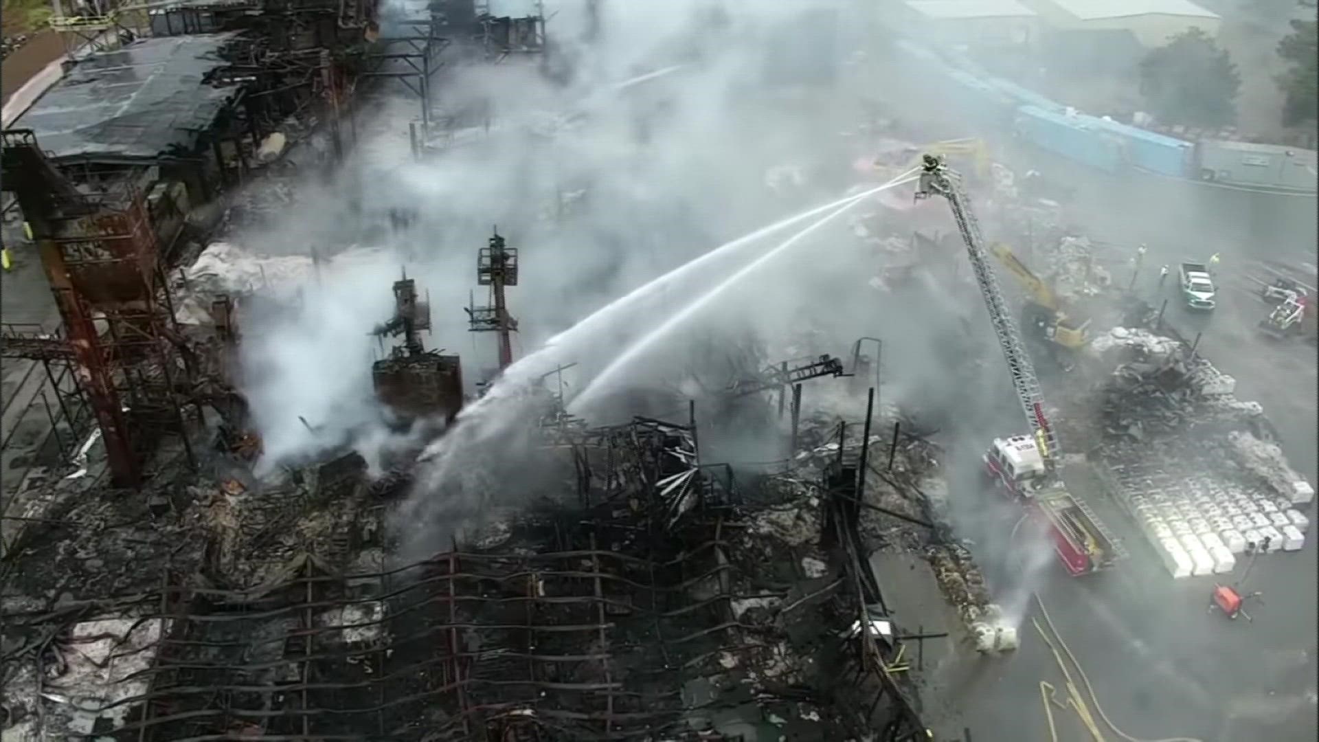 Drone video shared by the City of Winston-Salem Friday showed firefighters spraying water on the plant fire at Weaver Fertilizer