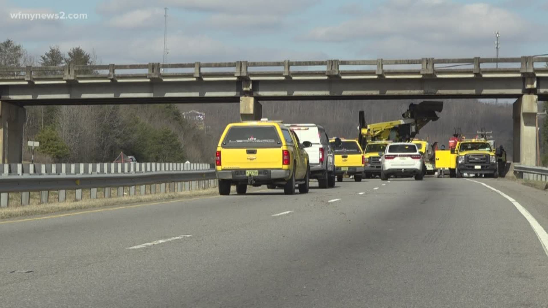 Troopers say the highway closed after a tractor-trailer crashed into a bridge Wednesday morning. The crash caused another car to collide with a beam that fell from t