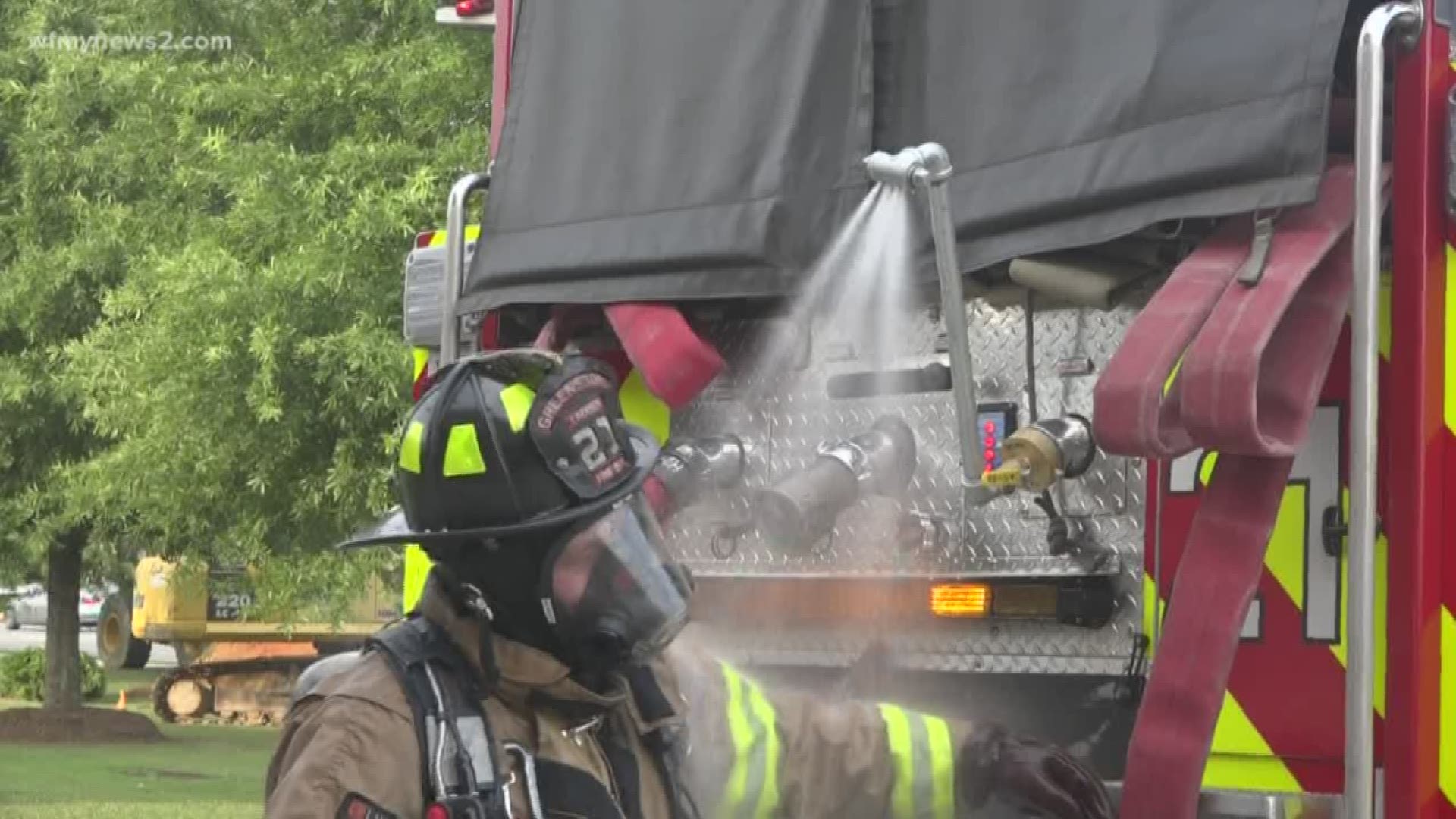 While still on scene, firefighters attach the shower to the fire truck to easily wash-off any sort of harmful chemicals on clothing, gear, and equipment.