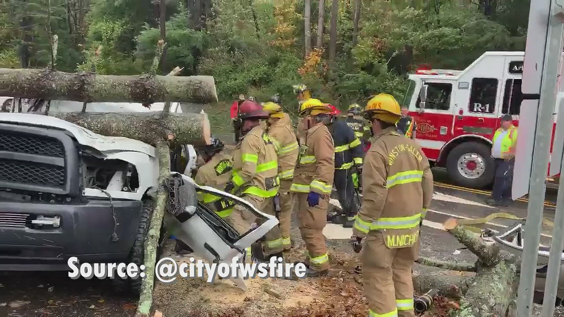 Winston-Salem firefighters got a person out of a truck after strong Zeta winds knocked a tree on top of the vehicle.