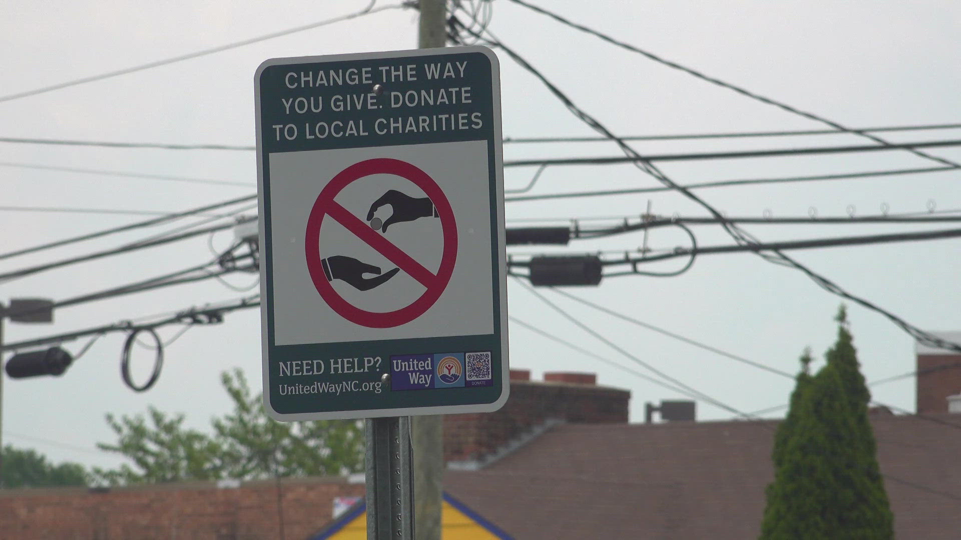 Signs around the city encourage people to donate to charity rather than give money to homeless people on the side of the road.