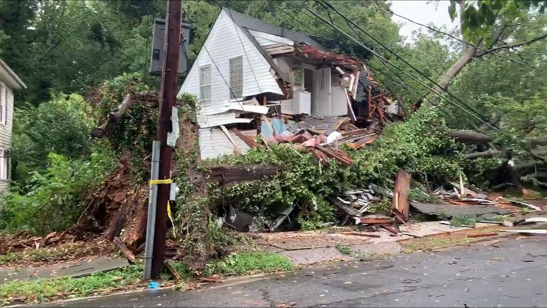 A huge tree fell across a home on Queen Street in Winston-Salem.