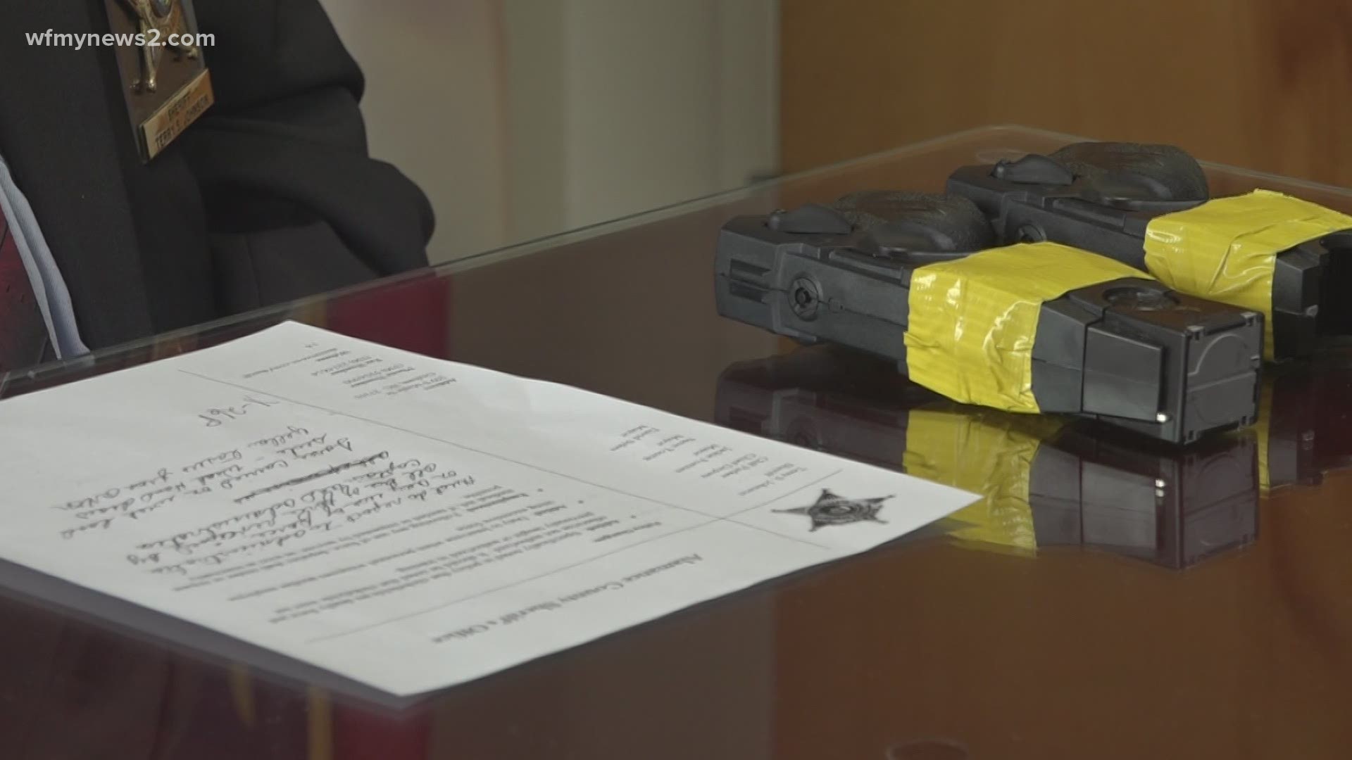 Sheriff Terry Johnson said his office will mark Tasers with yellow tape to distinguish them from firearms.