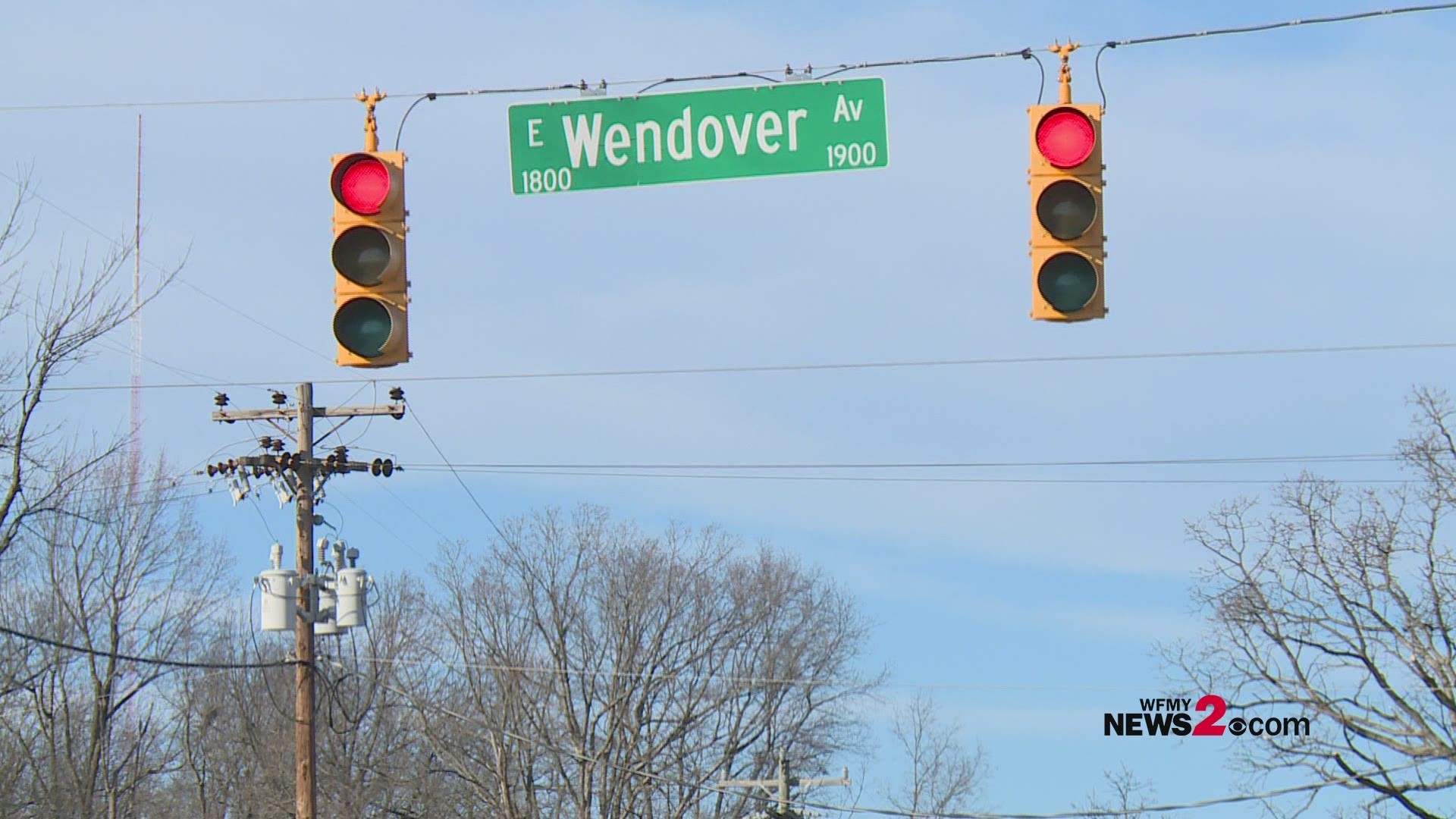 Police say an adult and a baby are okay after their SUV flipped when another SUV hit their vehicle on E. Wendover Ave. at Gatewood Ave.