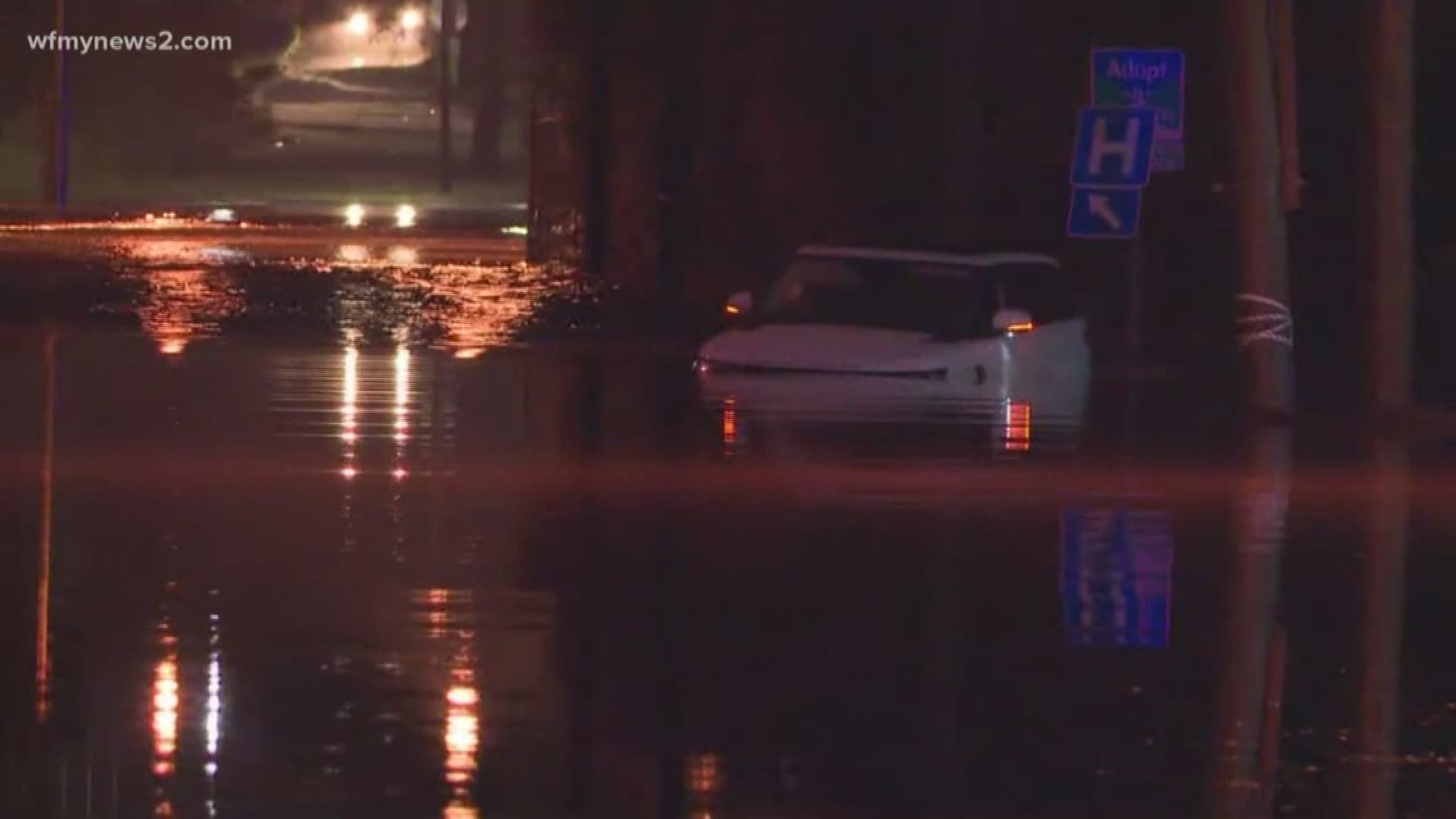 Wednesday night's flash flooding event put several cars under water at Revolution Mill Apartments. The nearby Buffalo Creek rose even higher than it did when Hurricane Florence brought torrential rain to the Triad.