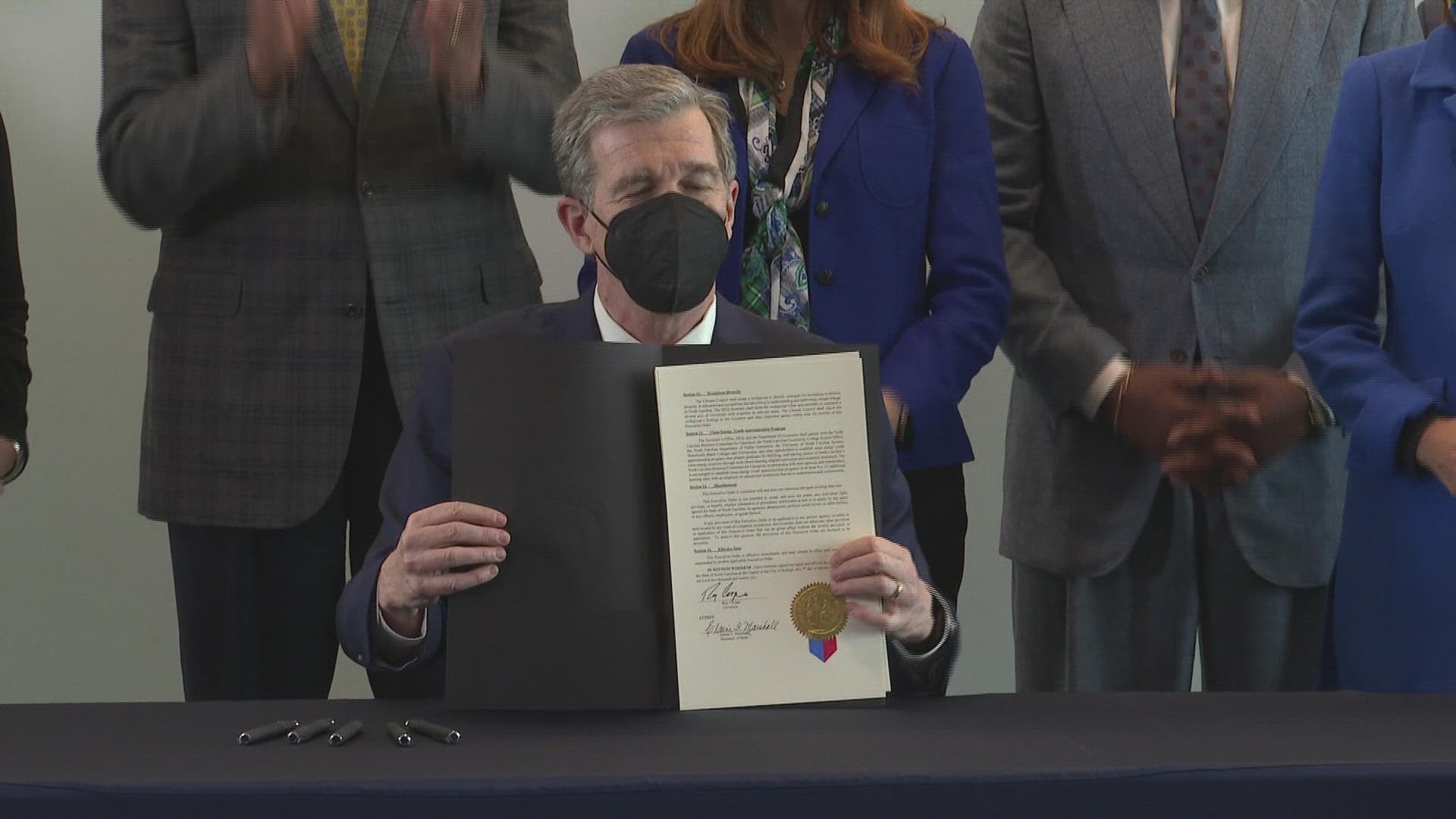 North Carolina Governor Roy Cooper signed an executive order Friday saying the state will achieve net-zero emissions by 2050.