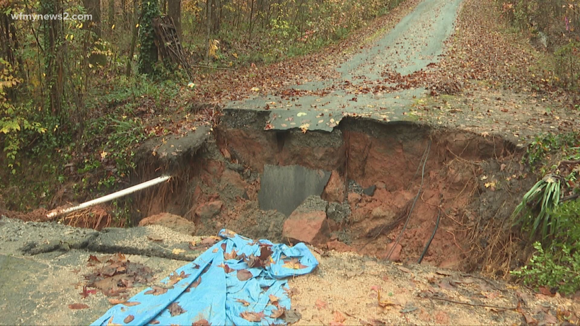 Heavy rainfall washed away Stonegate Drive in Davidson County. People are unable to drive their cars over the road to get back home.