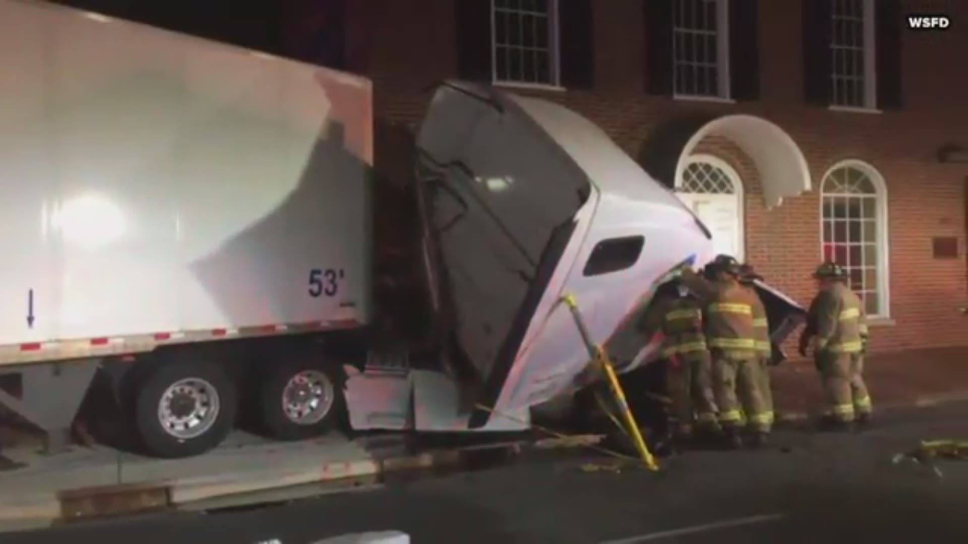 A tractor-trailer has crashed into a building on South Main Street in Winston-Salem.
