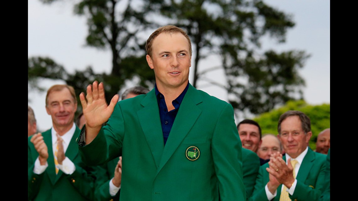 a green jacket is placed in a chair along the 1st tee in honor