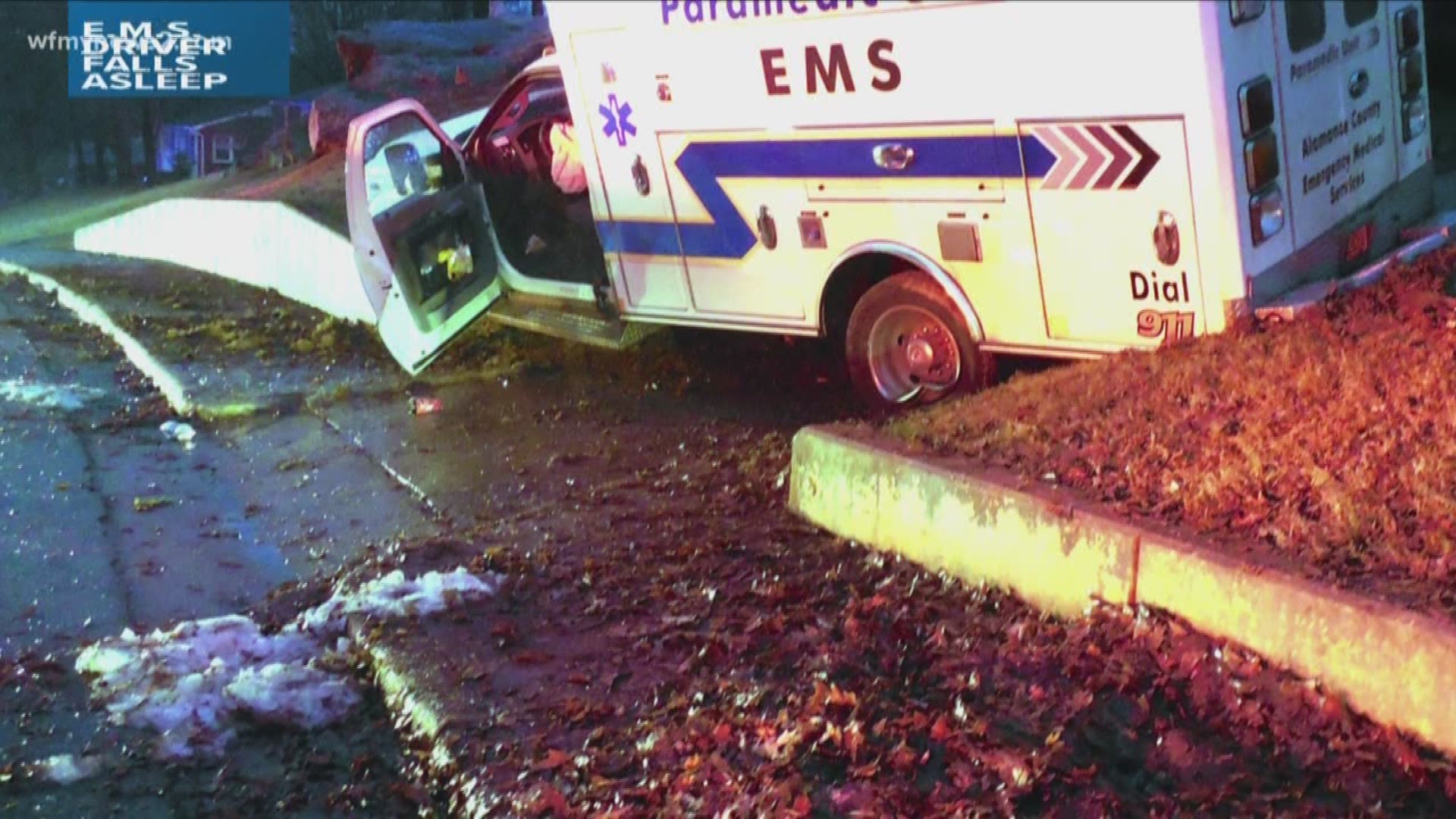An ambulance driver fell asleep at the wheel and crashed into a concrete wall.