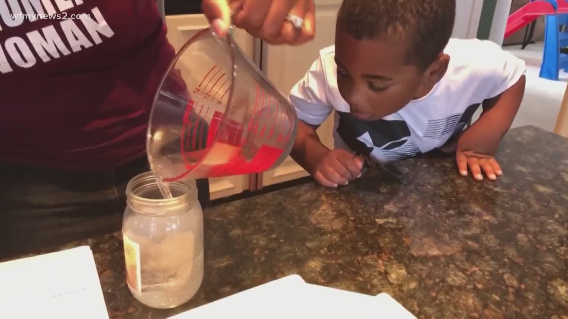 Tracey McCain's son, Josiah follows WFMY Meteorologist Tim Buckley's step by step instructions to make a cloud in a jar!