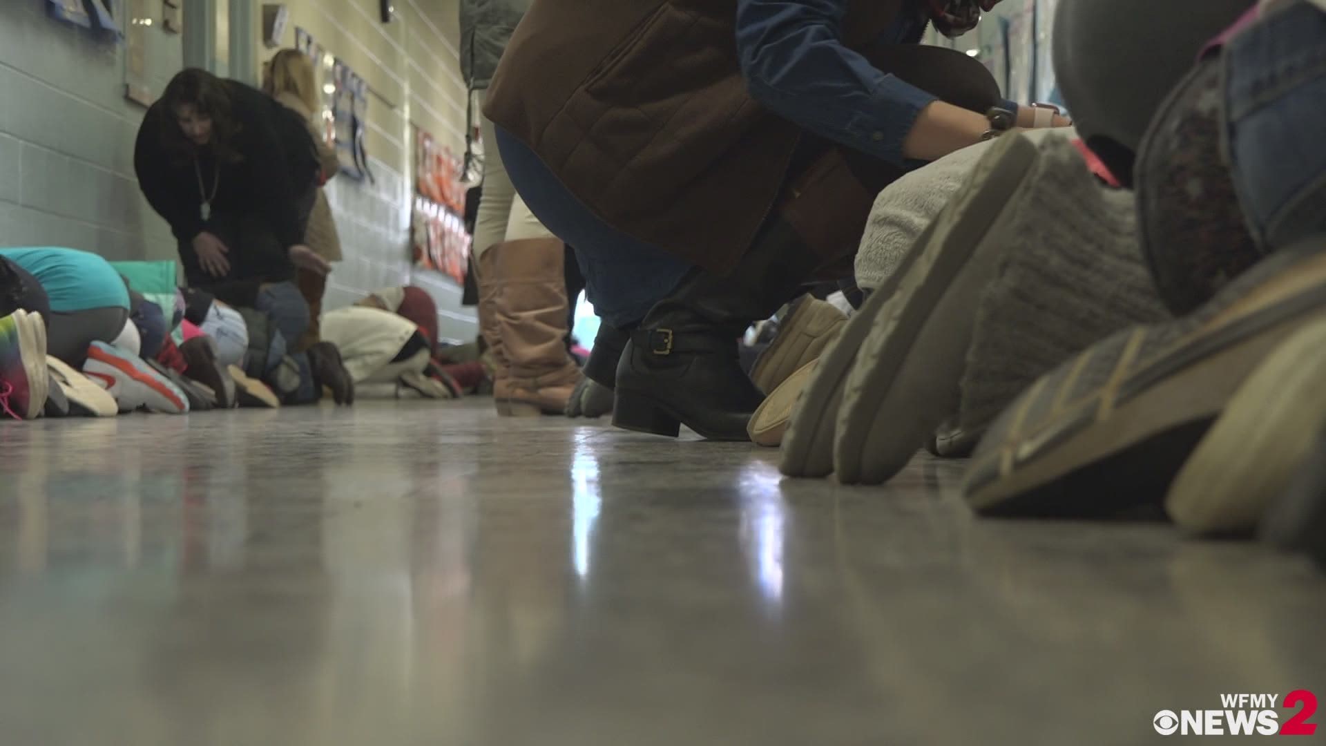 Students at Morehead Elementary School partake in a statewide tornado drill Wednesday as part of Severe Weather Preparedness Week.