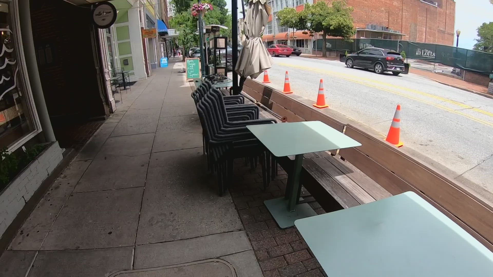 Crews are installing new permanent outdoor spaces for restaurants in Downtown Greensboro.