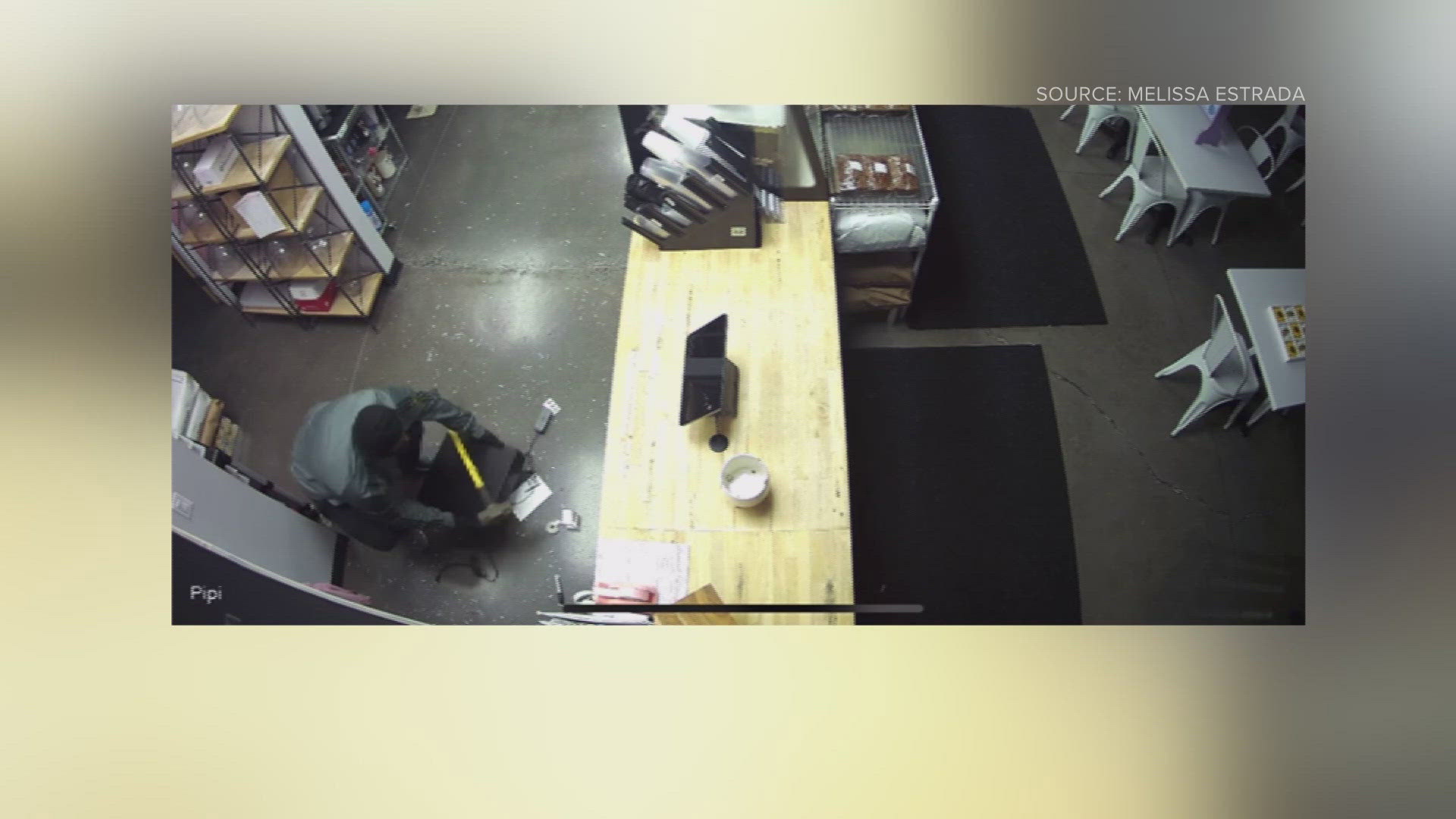Surveillance video shows someone busting into Sweet Dough Bake Shop and stealing a register.
