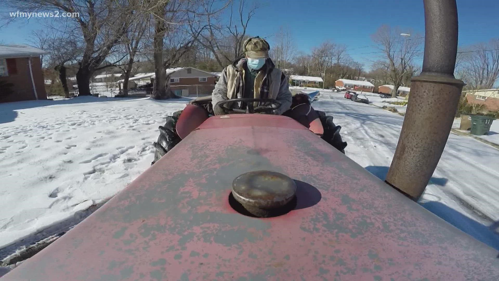 73-year-old Louis Gaddy says his tractor is named "Old Massie." It chugged along, helping clear roads in east Greensboro.