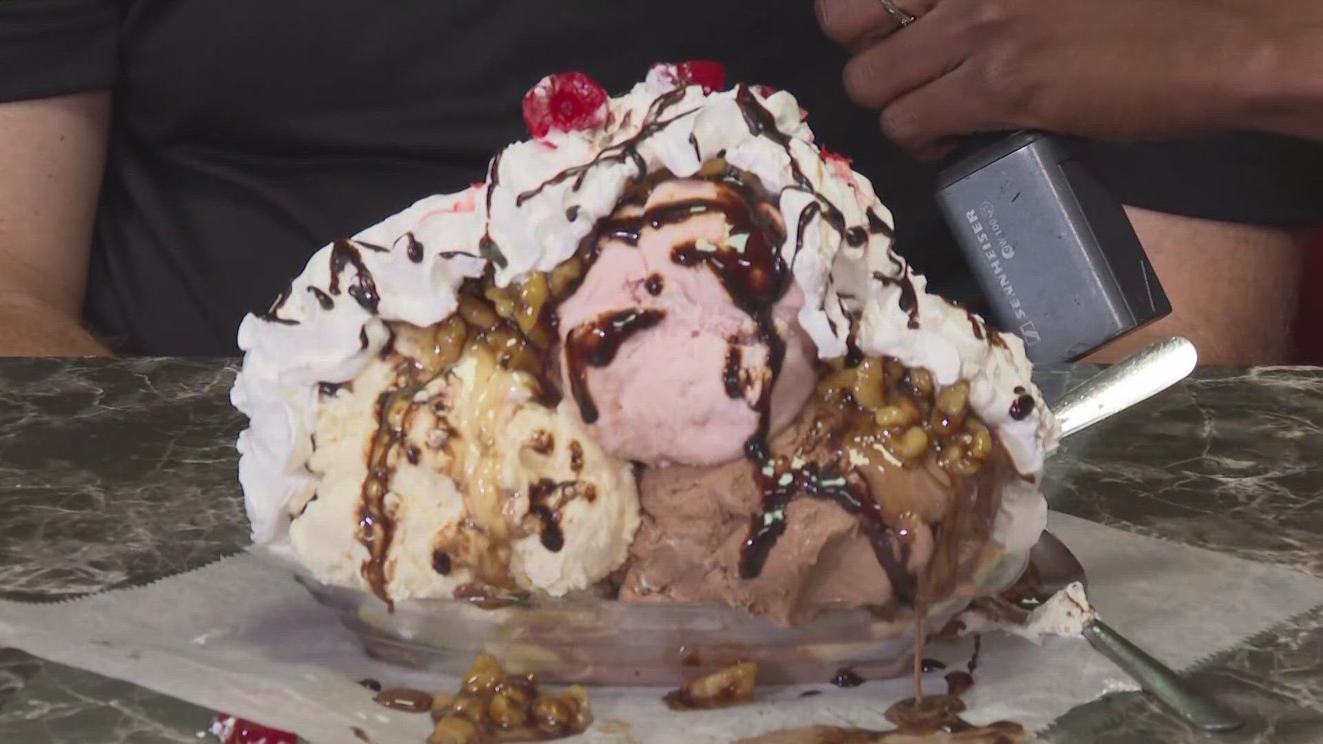 WFMY News 2’s Giselle Thomas and Christian Morgan try the popular sweet treat at the barbecue center. 