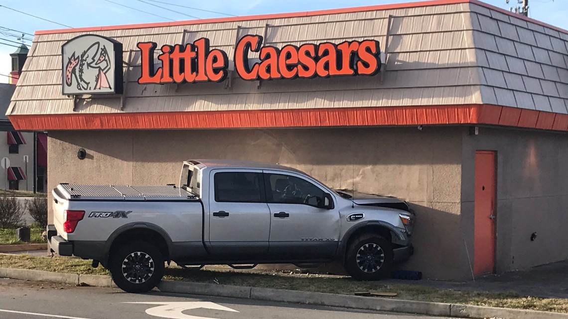Truck crashes into Greensboro Little Caesars after argument
