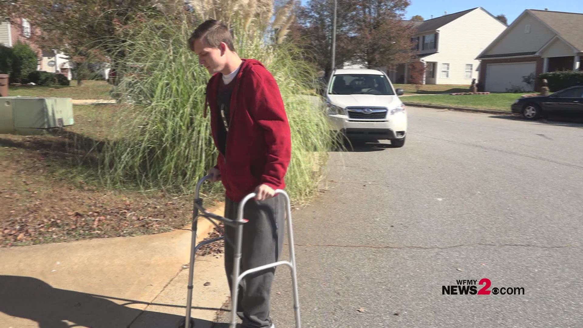 27-year-old Michael White now moves around with the help of a walker and a brace helps to hold his torso upright after jumping from window to escape house fire.