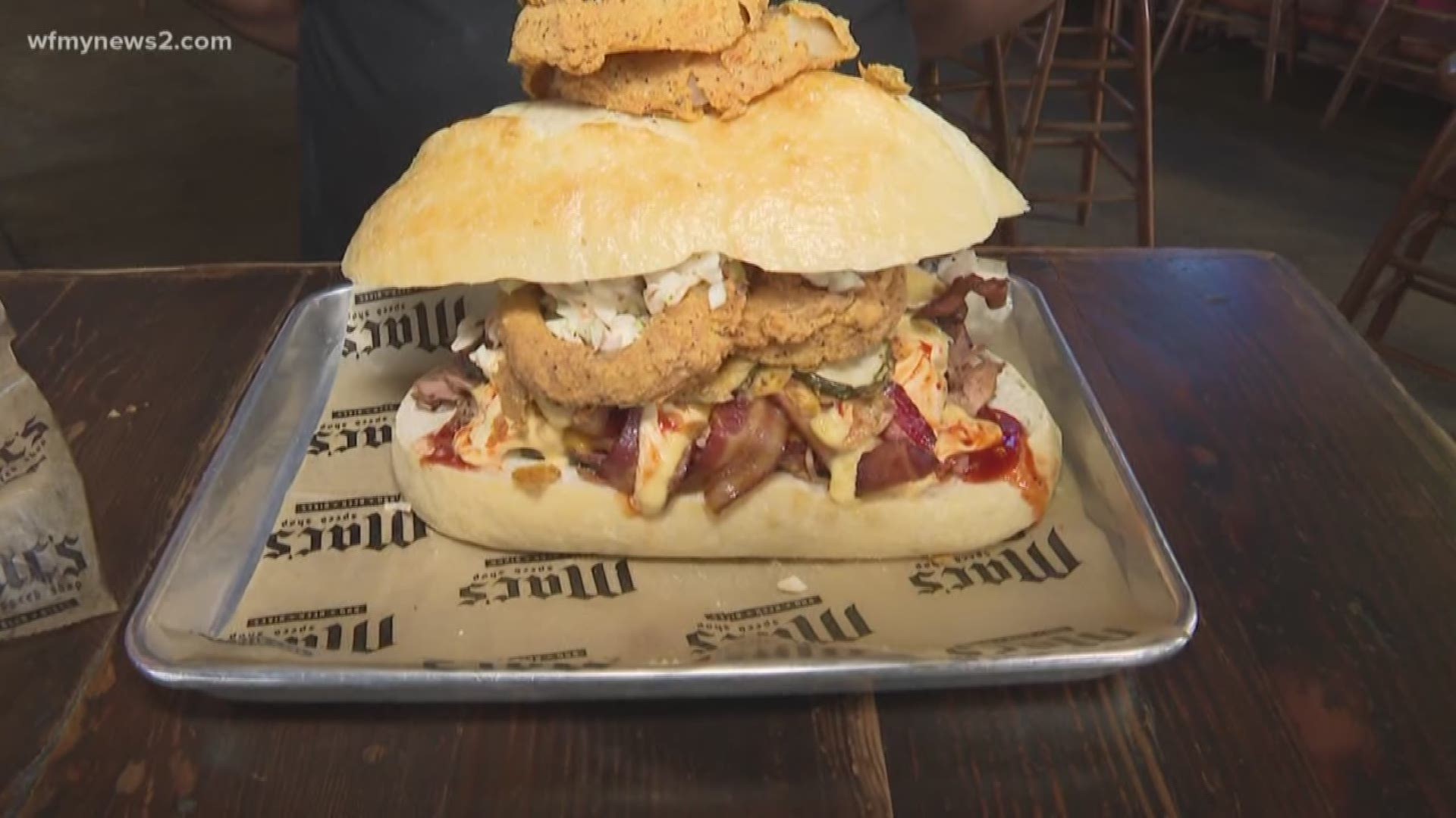 Mac’s Speed Shop shows off a sandwich challenge that only several customers have successfully finished.