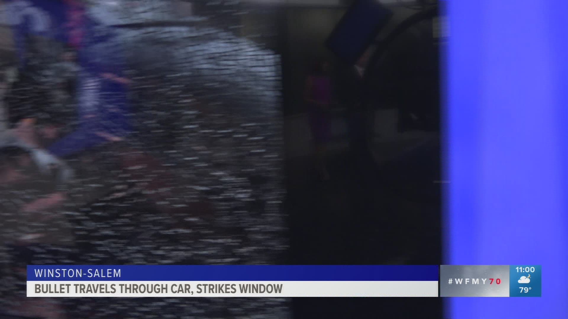 The woman was driving home from work when a bullet went through her window and shattered the passenger window.
