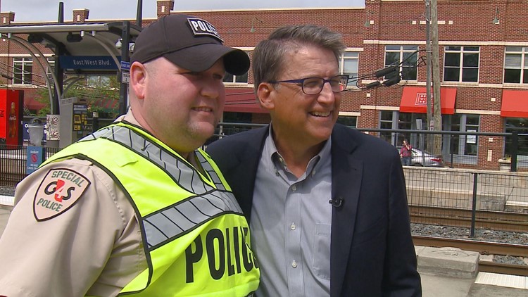 Pat McCrory takes a picture with officers