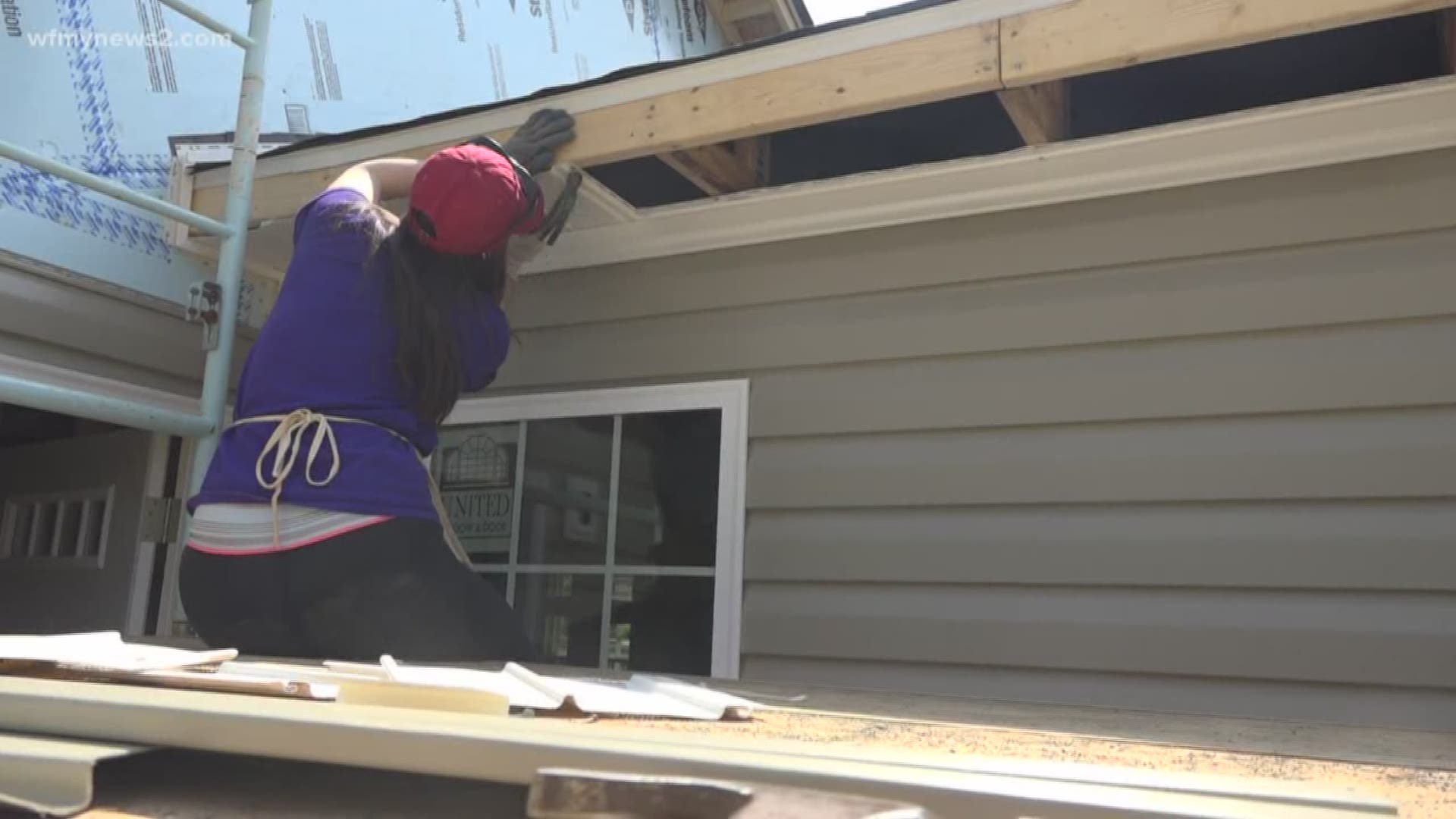 More than two dozen students from a college in Minnesota are spending their spring break building a house in Winston-Salem with Habitat for Humanity.